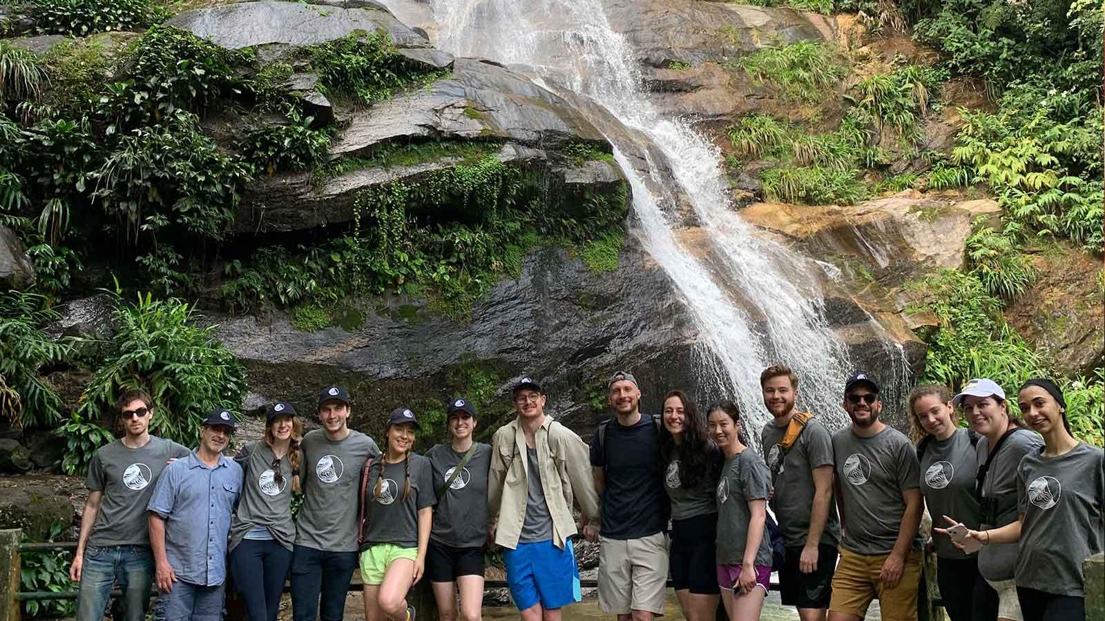Group of Elisabeth Haub School of Law students in Brazil next to a waterfall