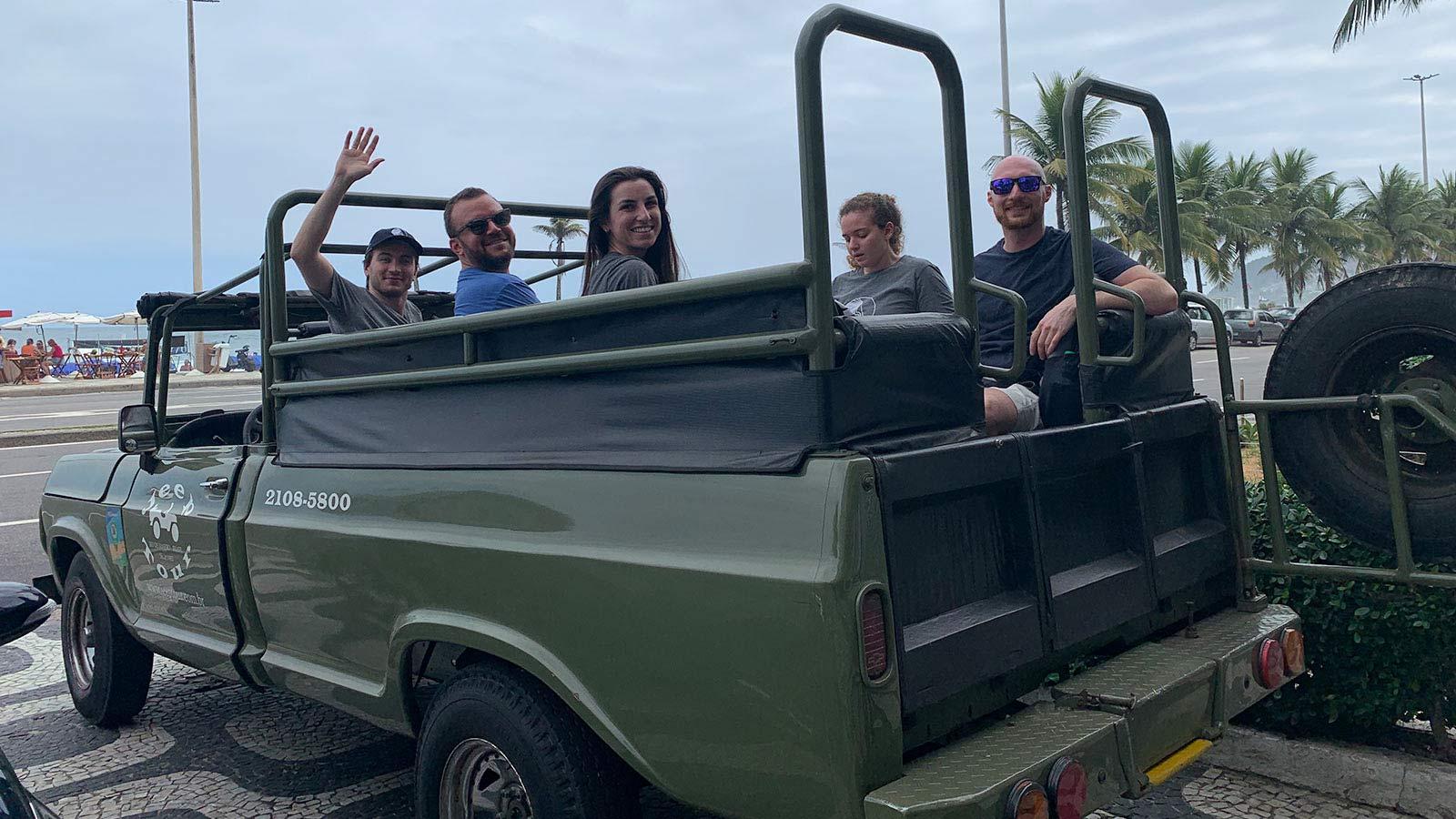 Group of Elisabeth Haub School of Law students in the back of a Jeep near a beach in Brazil