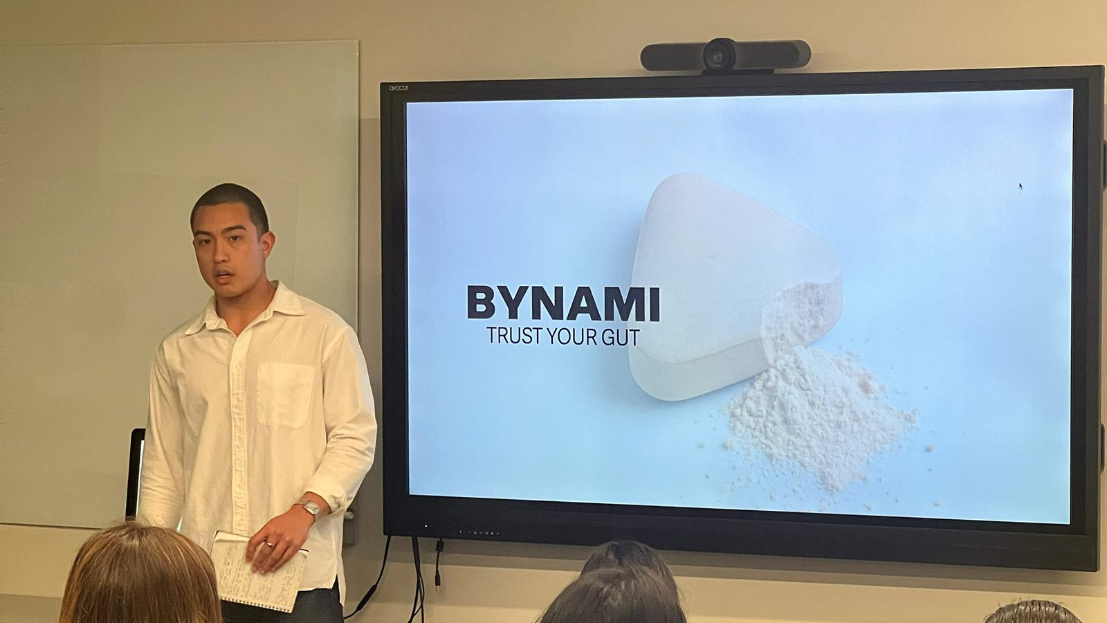 Student introducing BYNAMI product on screen