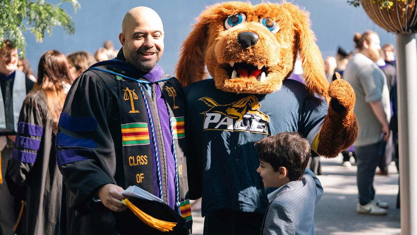 Haub Law grad posing with T-Bone.
