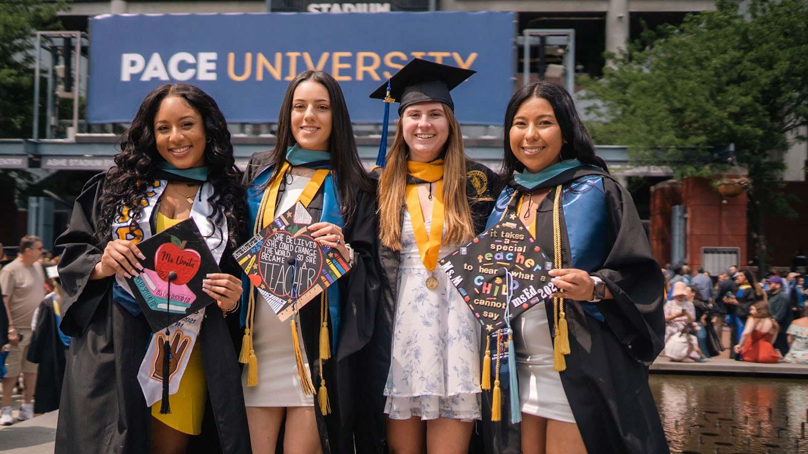 pace graduates posing for the camera