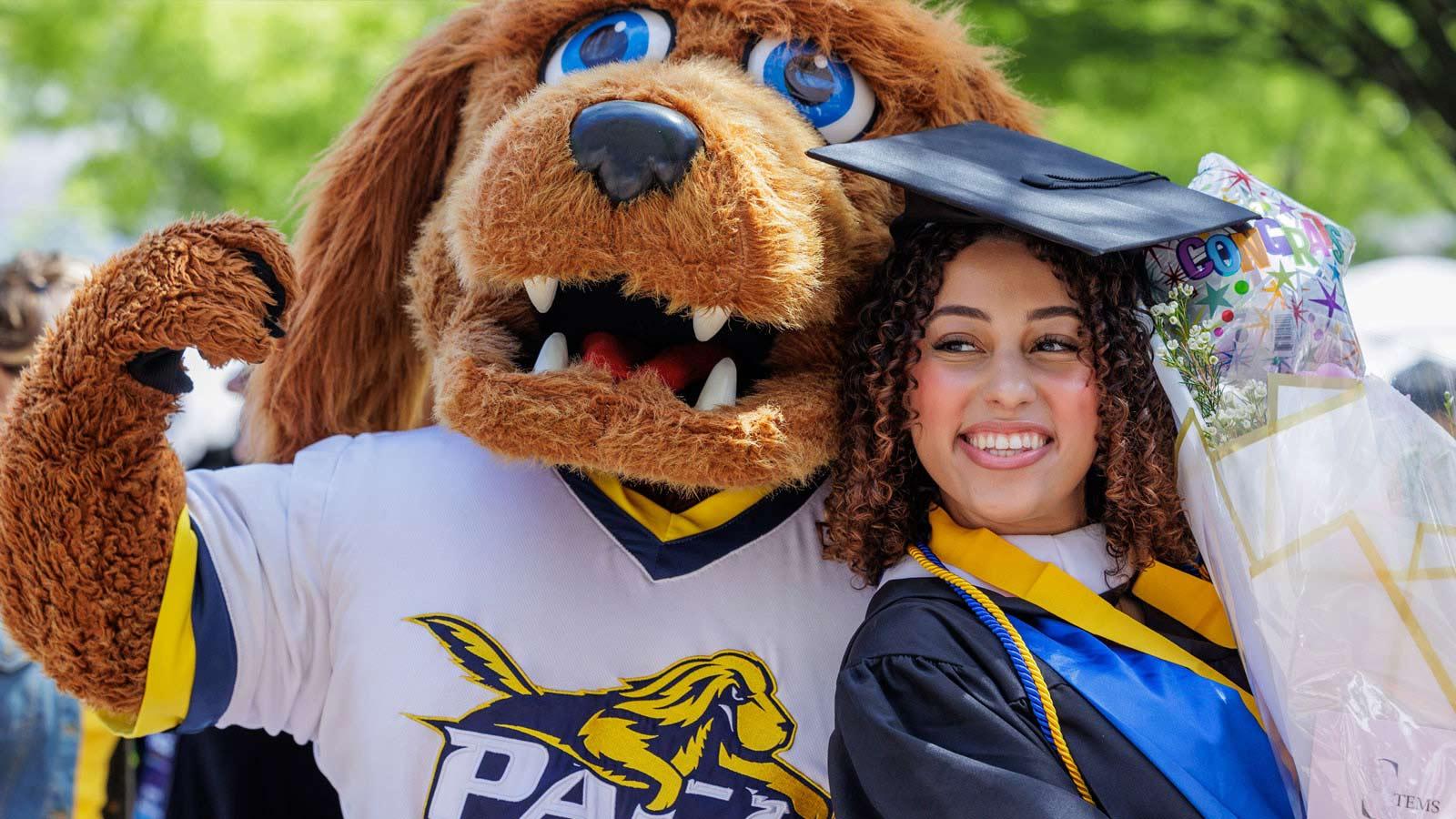 Graduate posing with T-Bone.