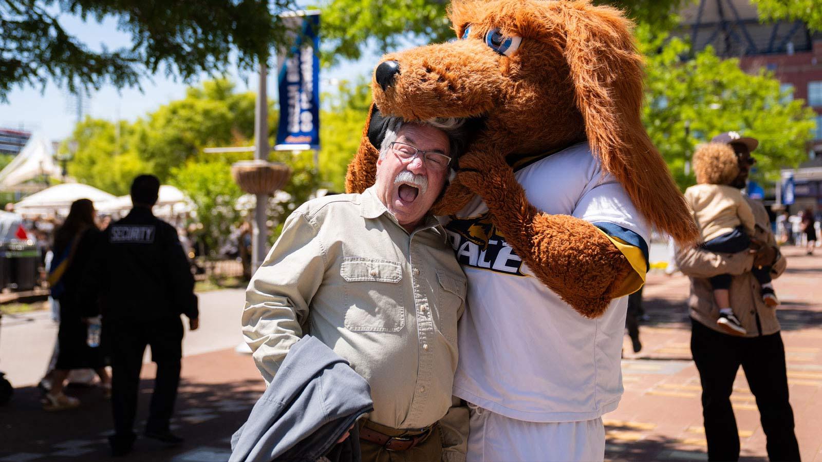 An older man posing with T-Bone.