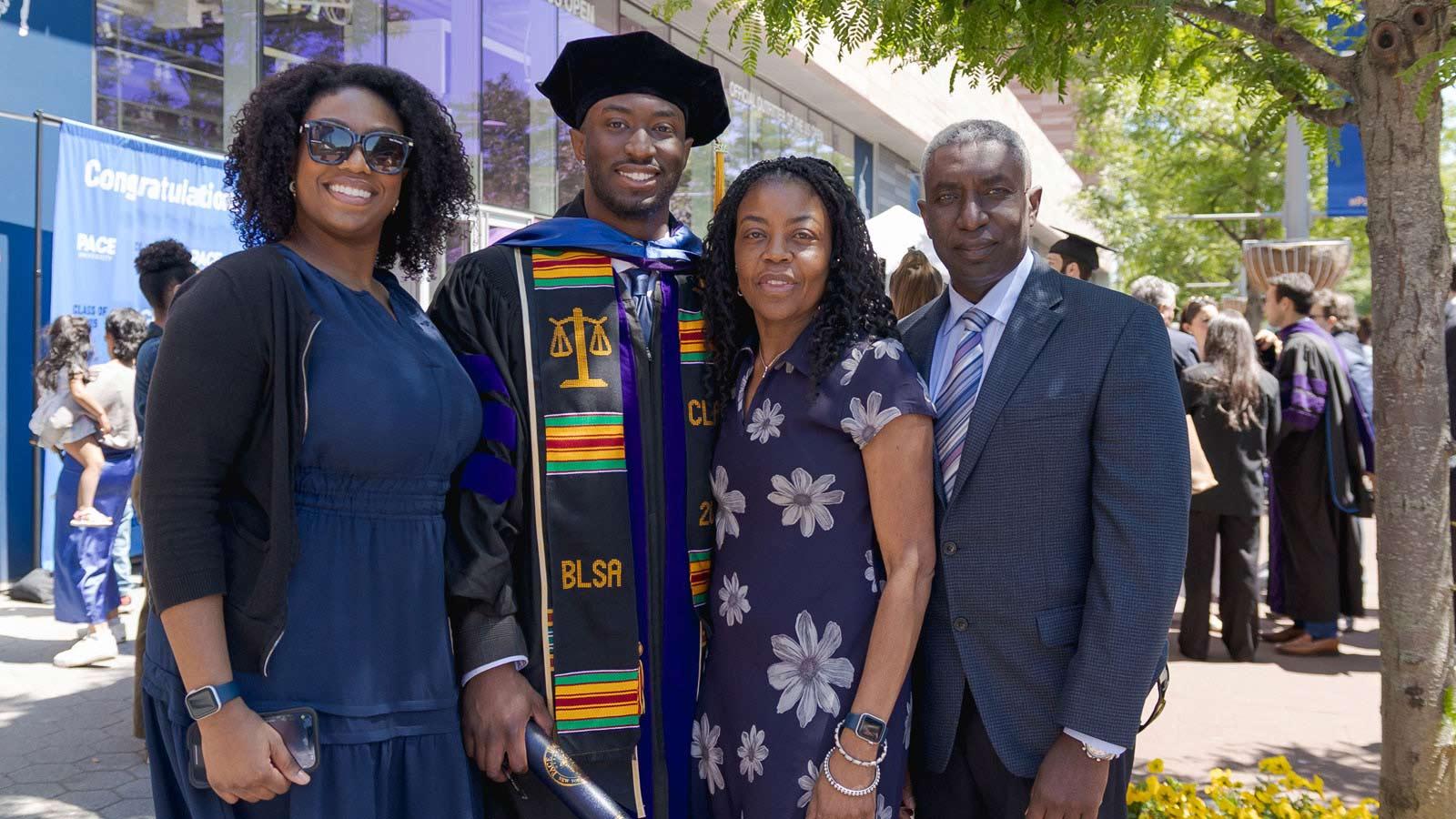 A Law School graduate posing with family.