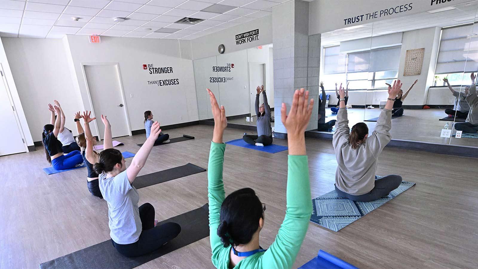 People doing yoga at the wellness center at Pace University