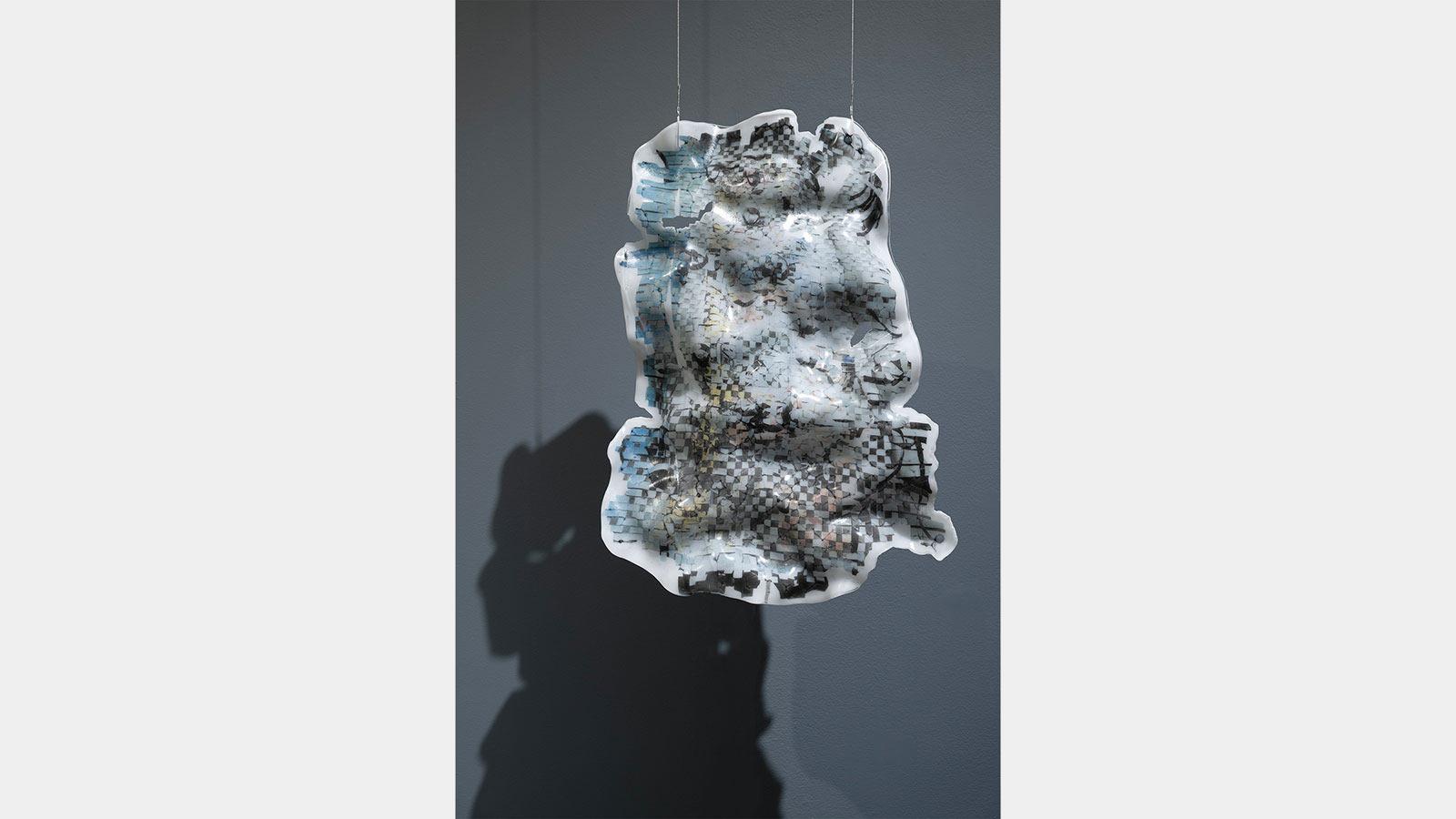 Abstract art piece of a coffin filled with artificial flowers and studio light by Juyon Lee