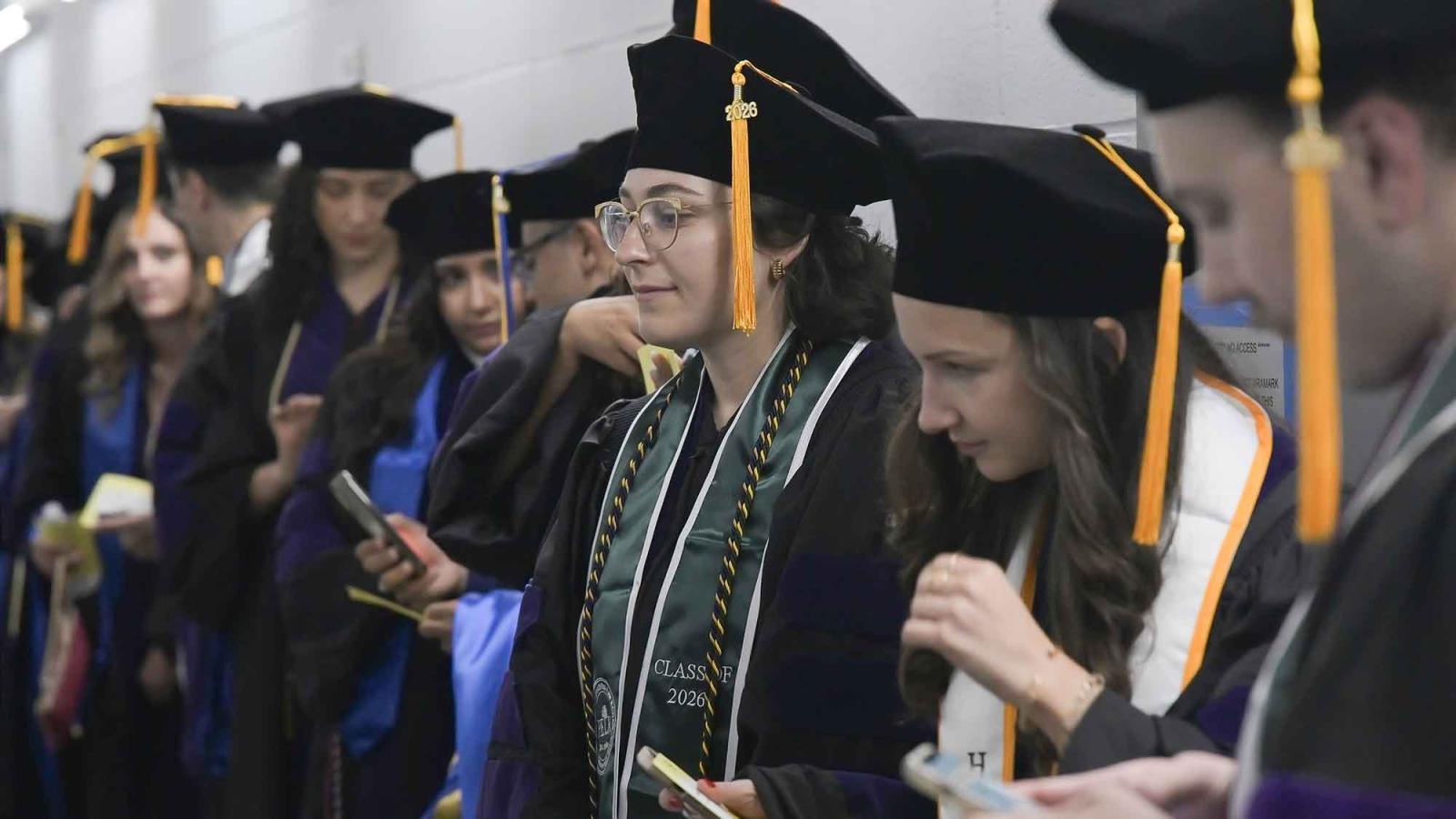 Pace University Elisabeth Haub School of Law students line up for their ceremony