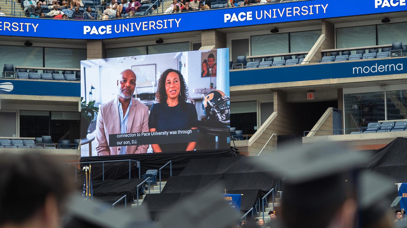 The Henry Family addressing the graduating class via video.