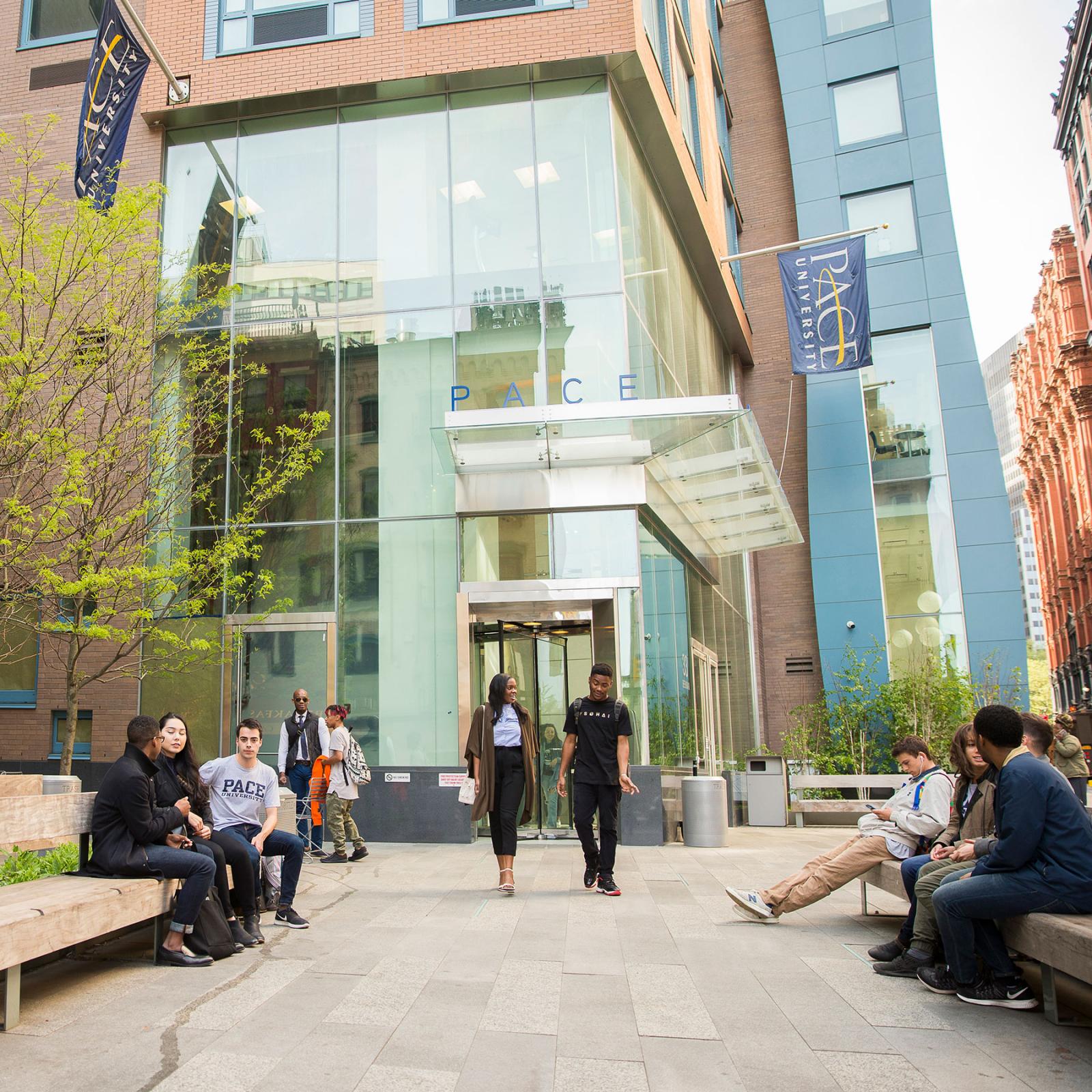 Students walking out of a residential hall in NYC.