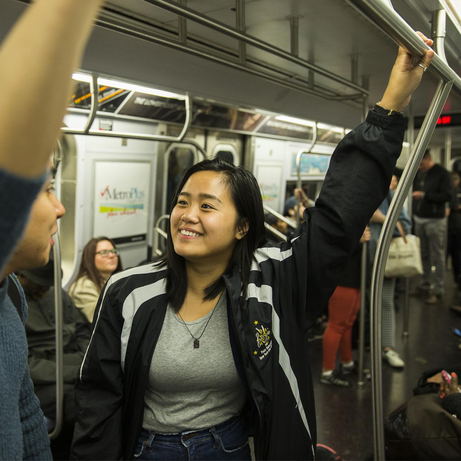 Student taking a ride on a Pace University shuttle bus.