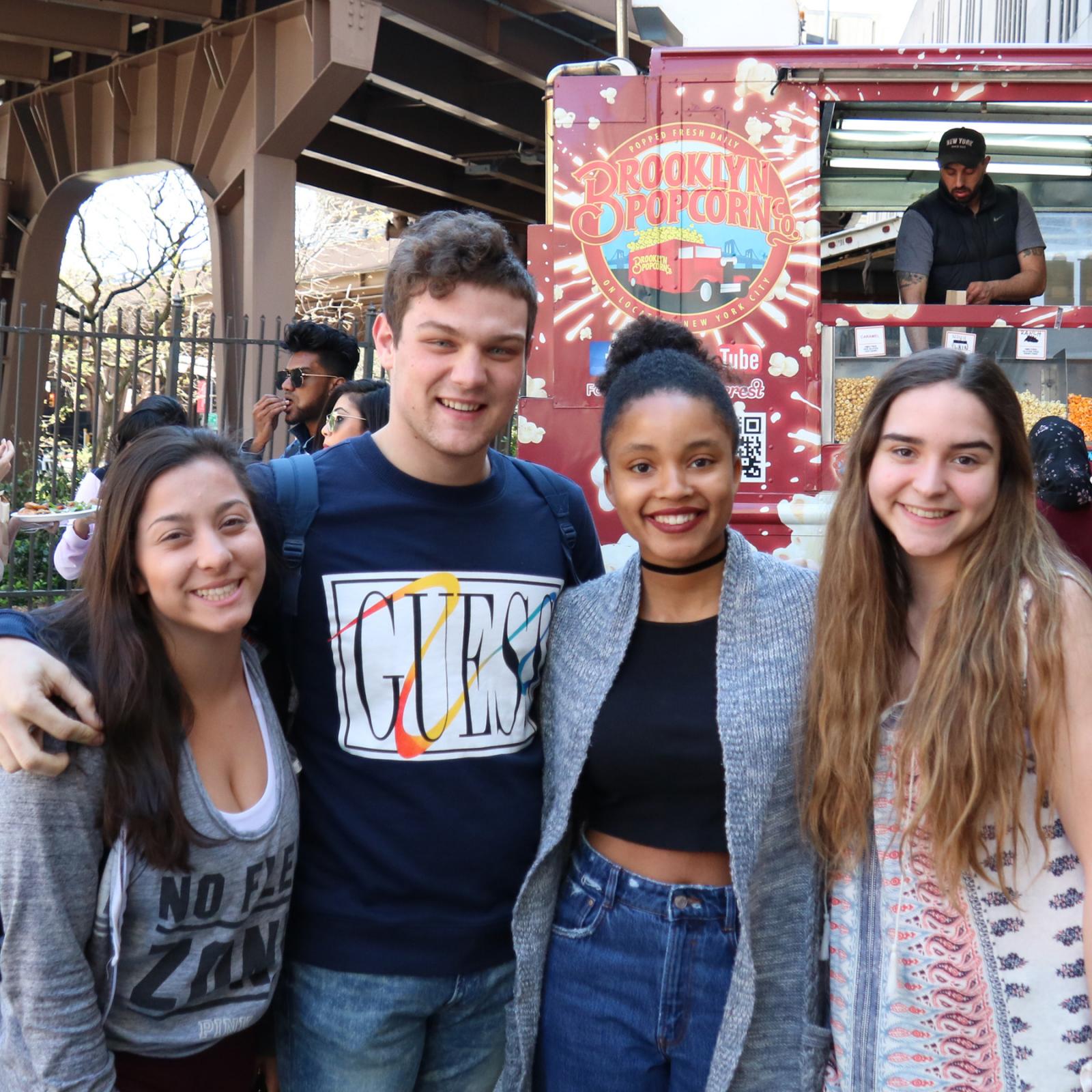 Group of students smiling at the camera.