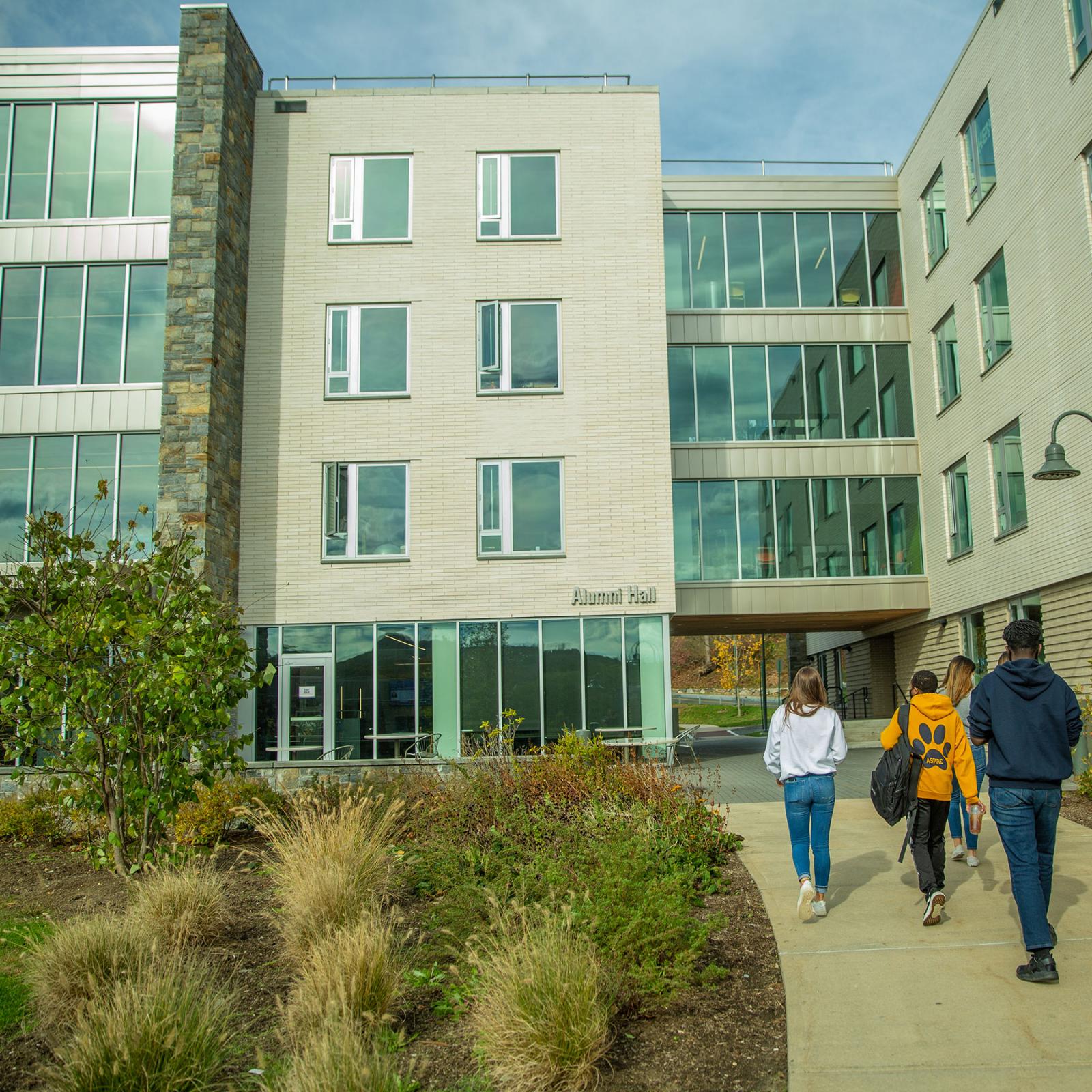 Students walking into a residence hall.