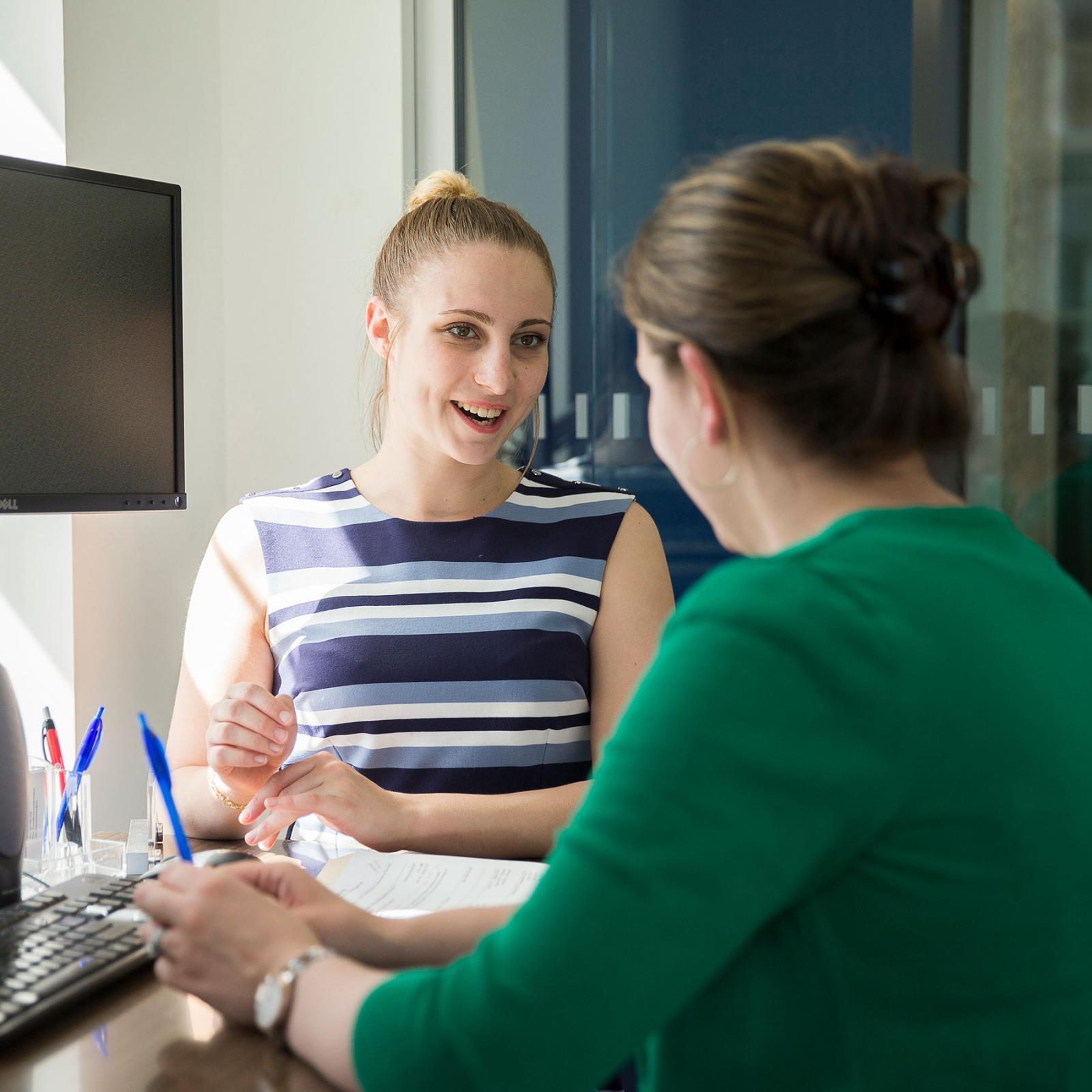 Student receiving guidance from a career counselor.