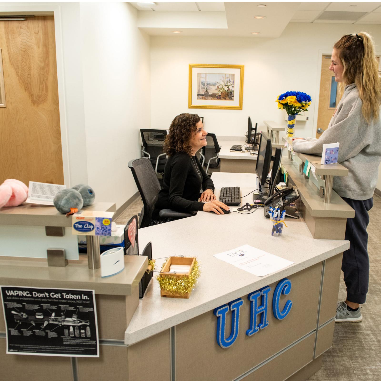 Student checking in at the University Health Care.