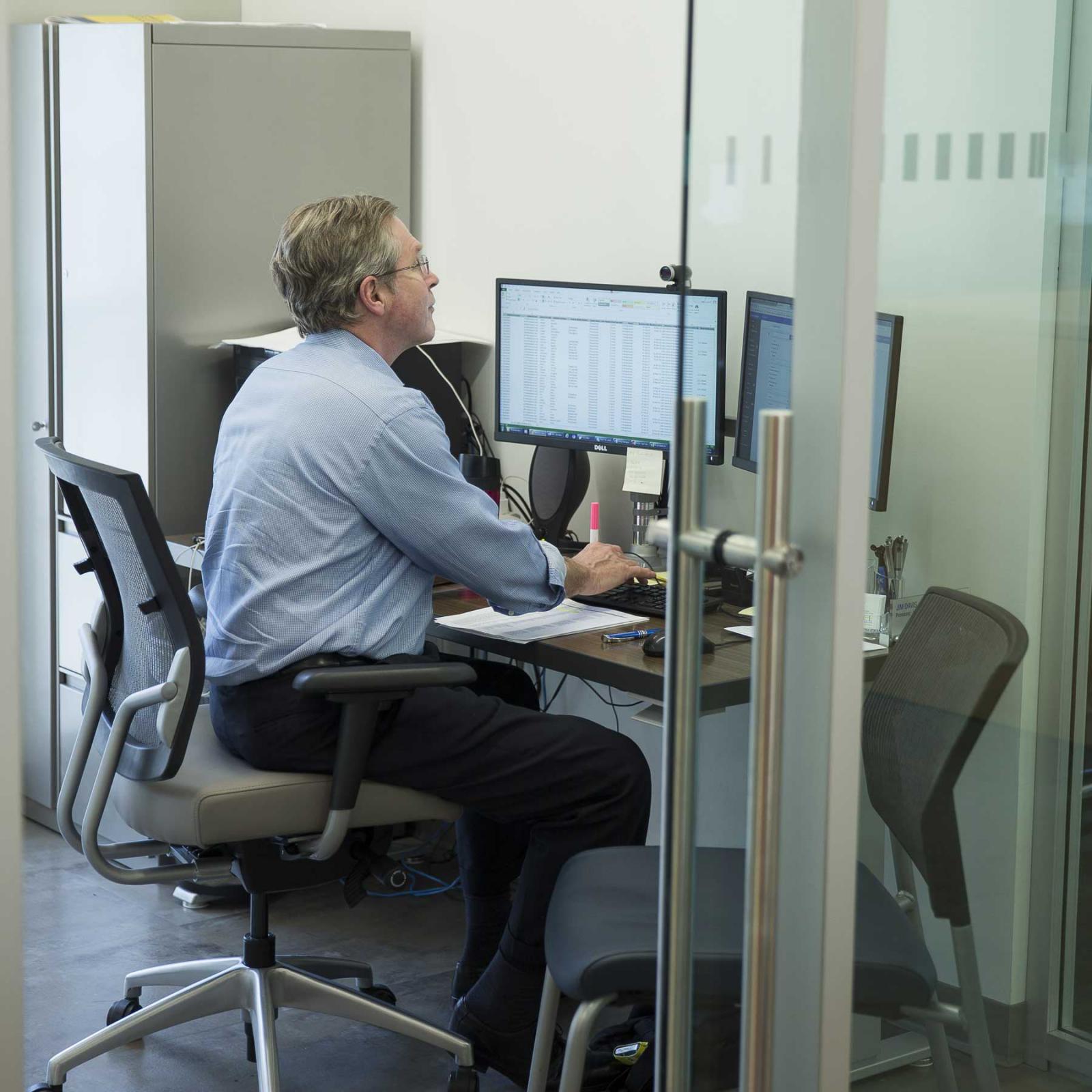 Pace employee working at his desk.