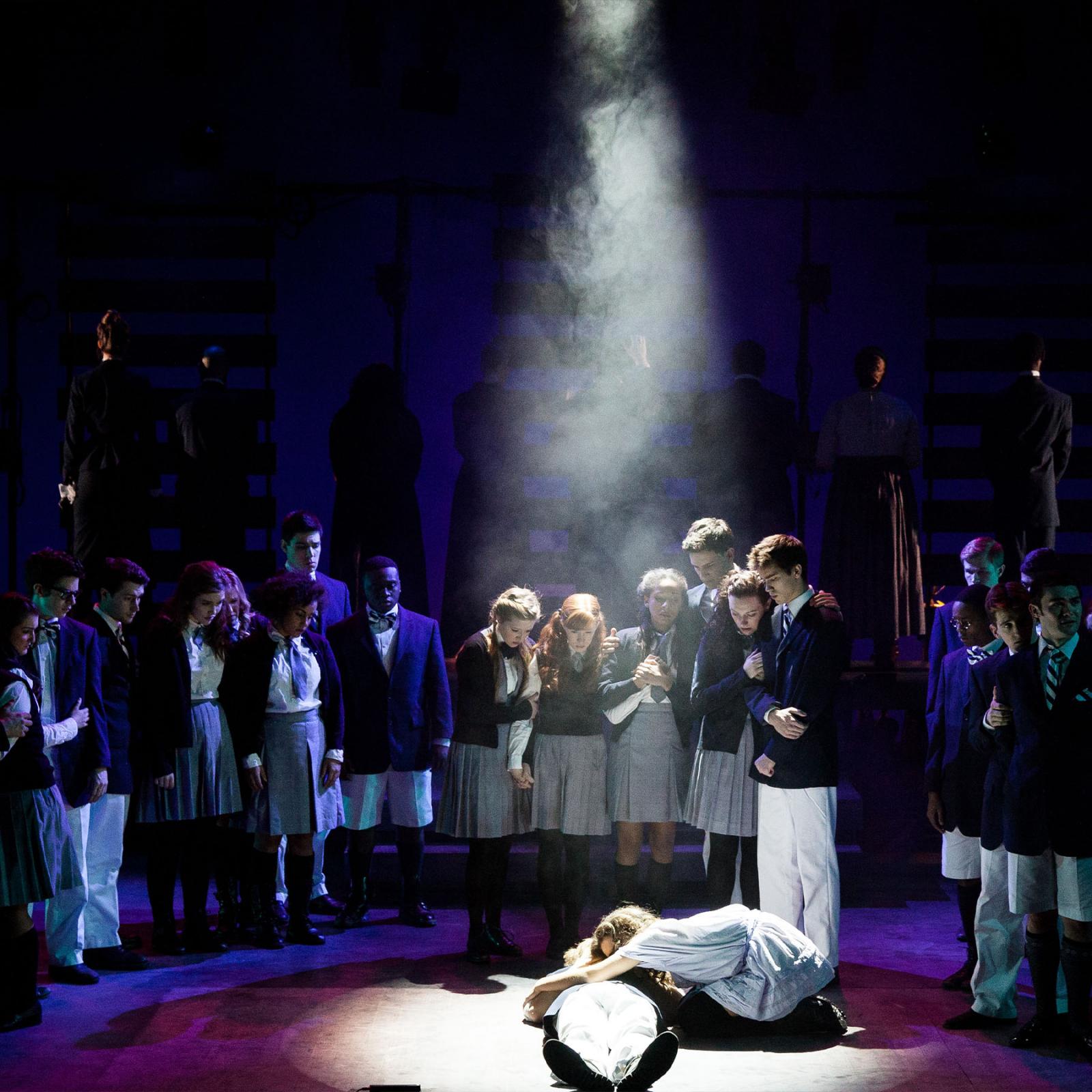 Students on stage performing Spring Awakening