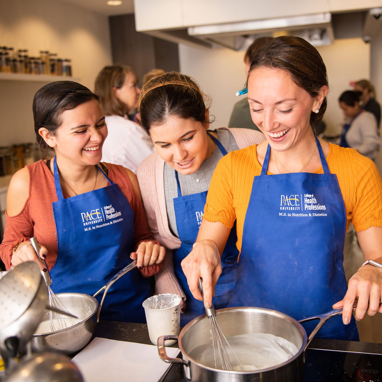 Students in the Nutrition and Dietetics program working in a kitchen setting.