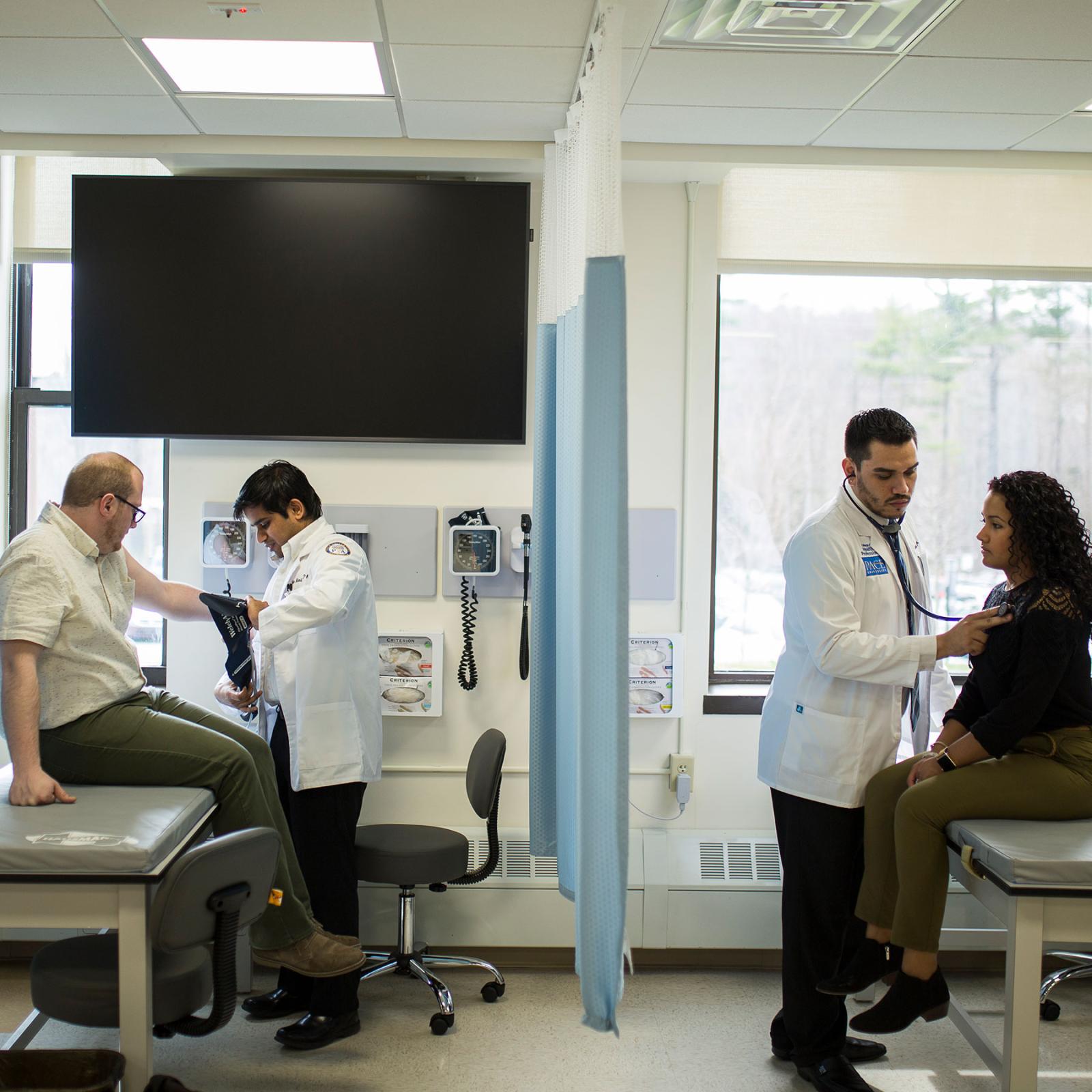 Physician Assistant students performing direct patient care.