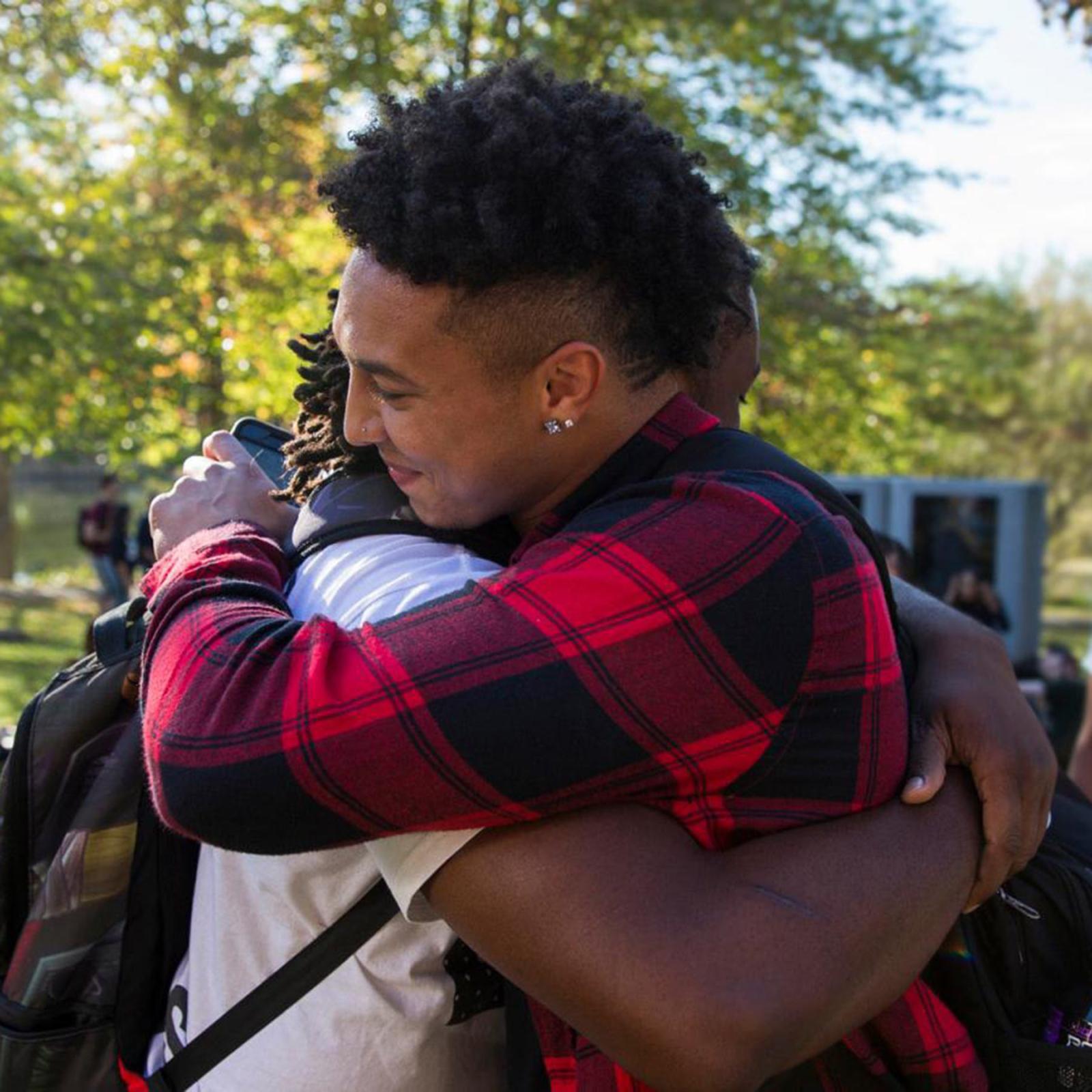 Two students hugging on the Pleasantville campus.