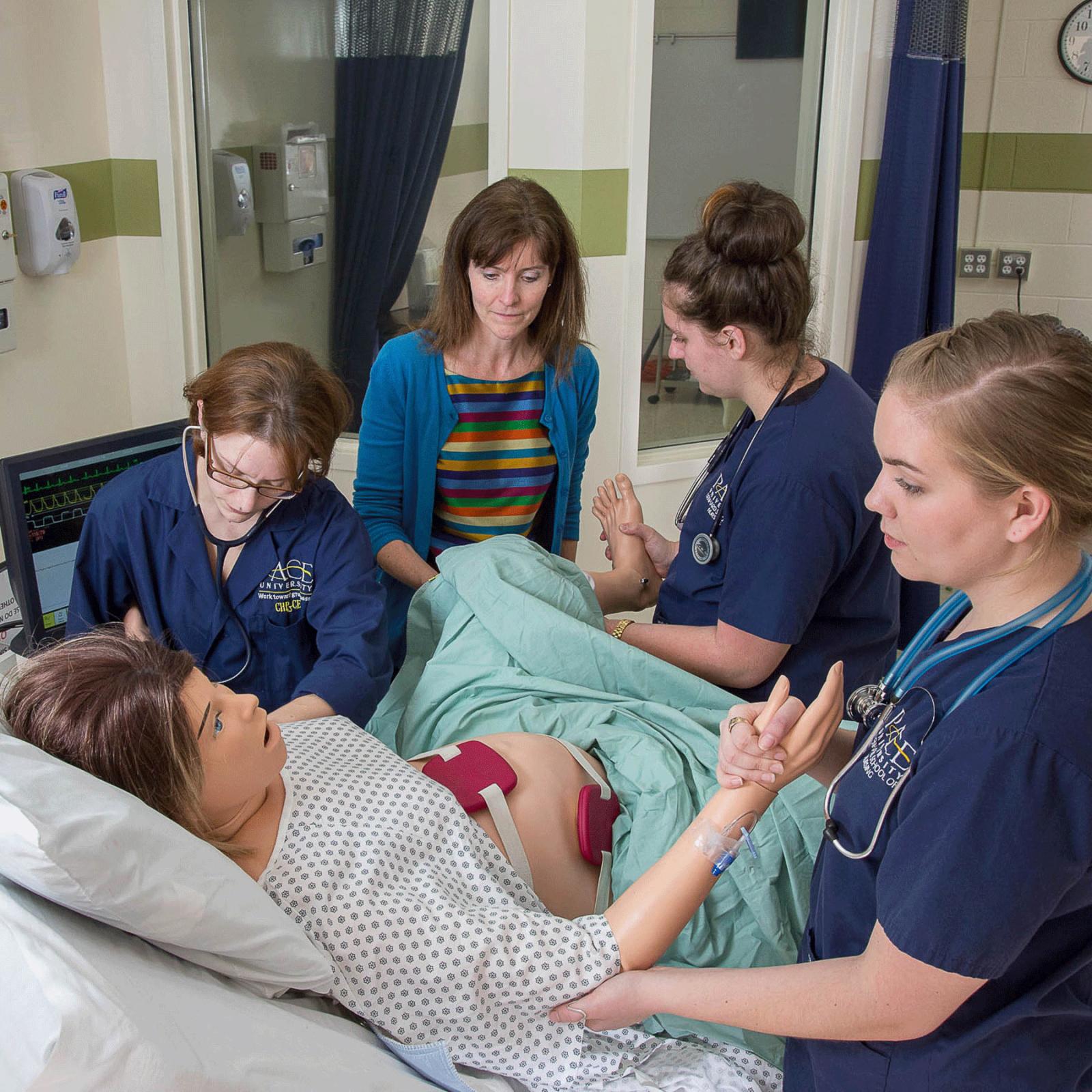 College of Health Professions student working with a faculty member in a simulation lab.