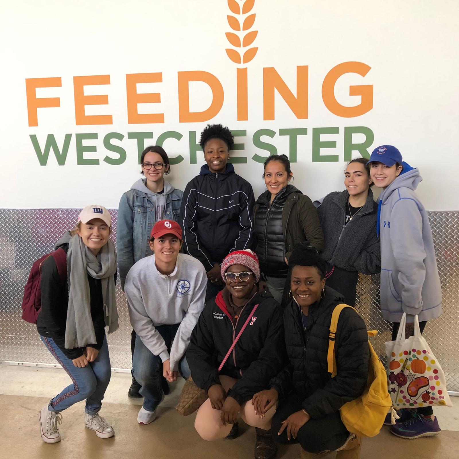 CCAR students infront of the Feeding Westchester logo