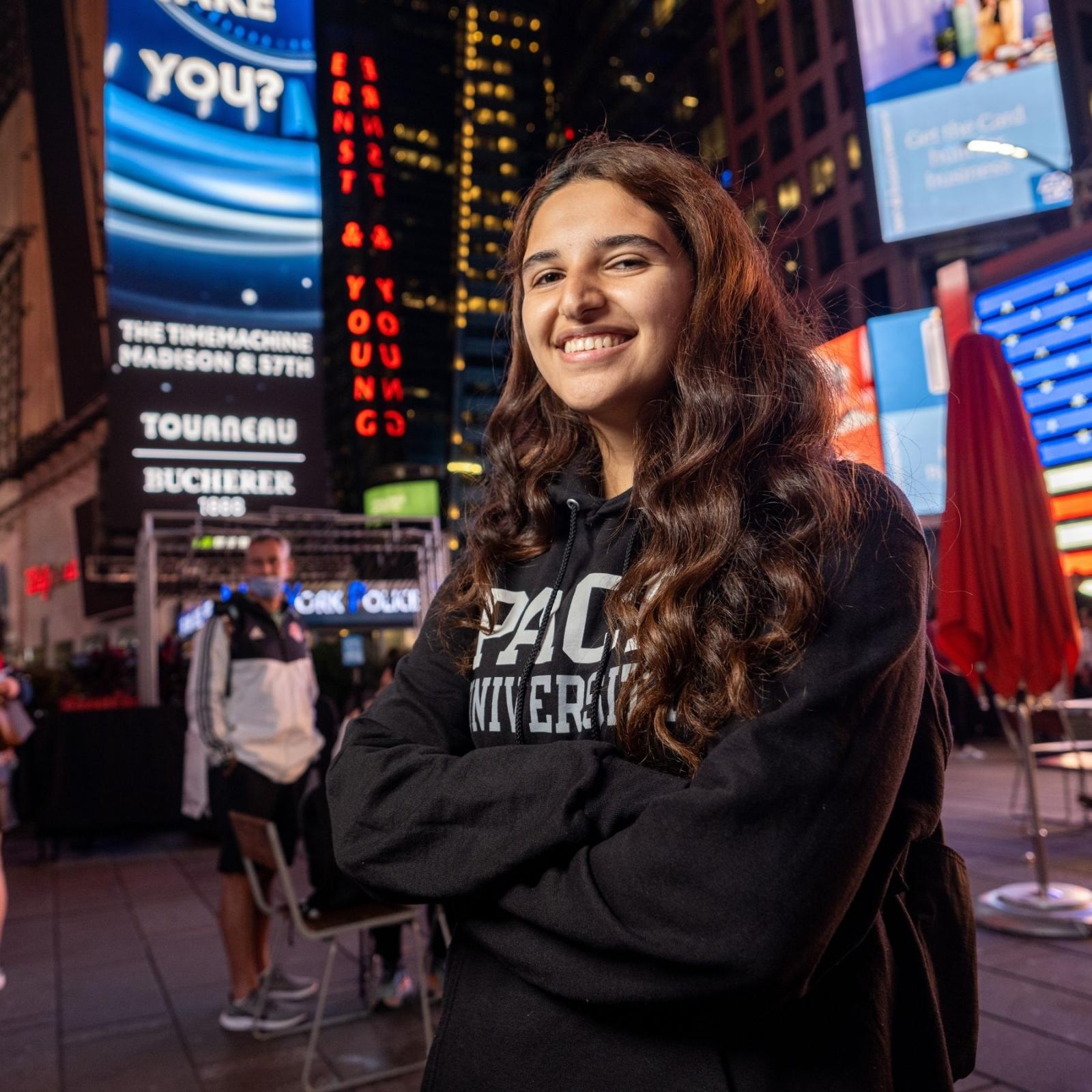 girl smiling in times square nyc