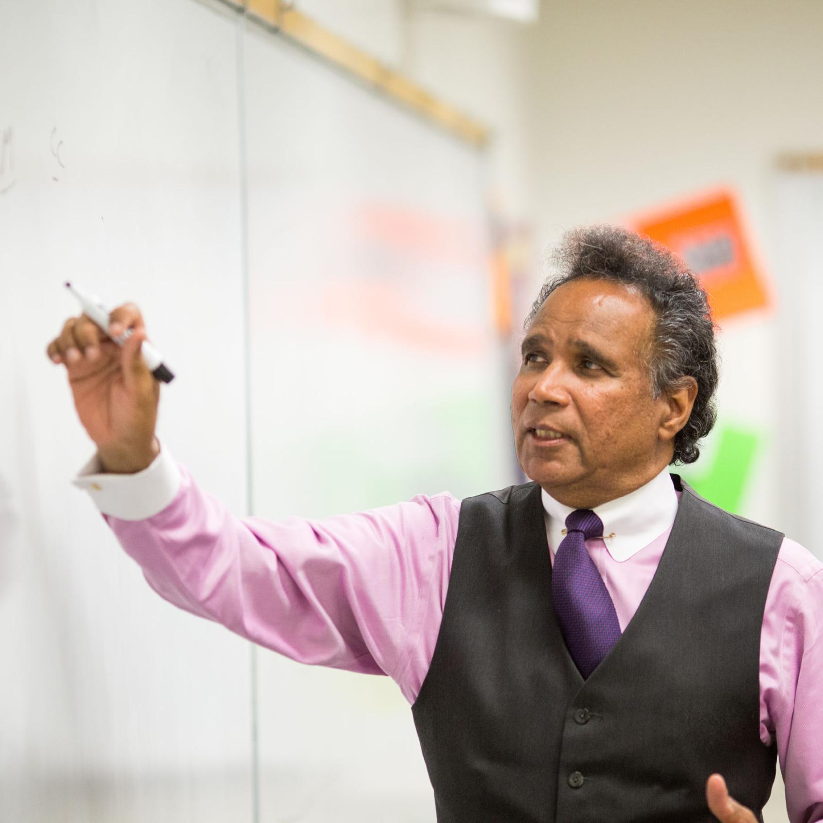 Lubin accounting professor emeritus Rudy Jacob teaching in a classroom at One Pace Plaza, New York City Campus