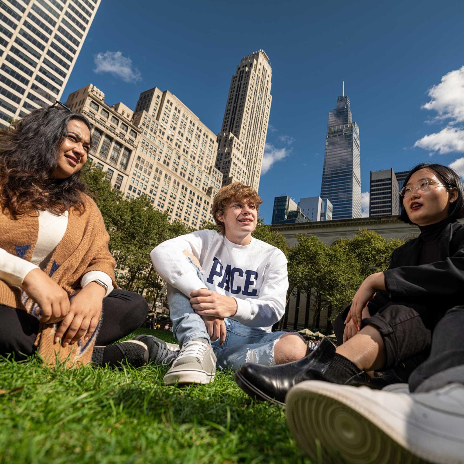 three pace students hanging out in Central Park