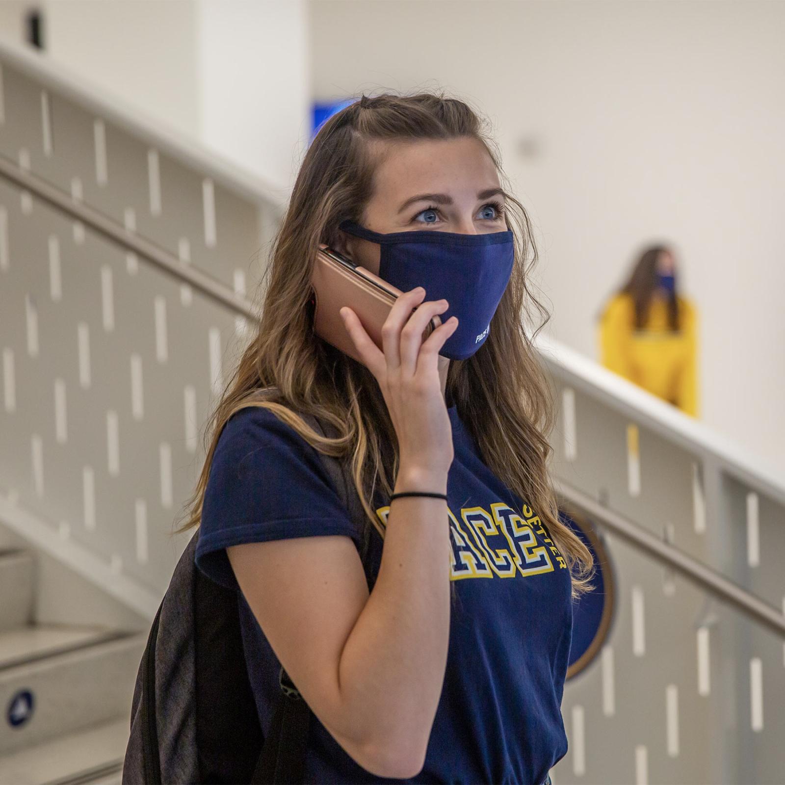 pace student on her cell phone