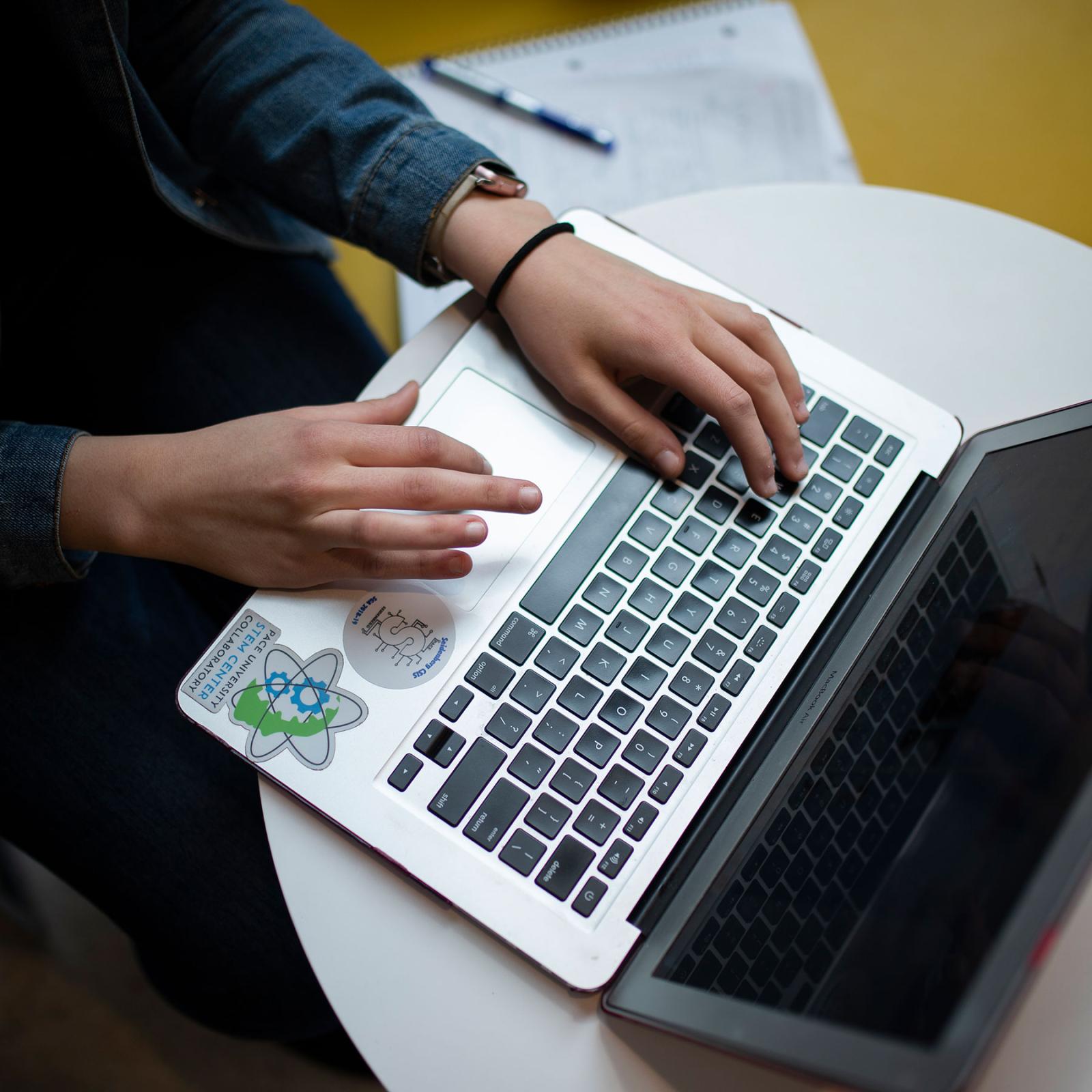 Student working on a laptop.