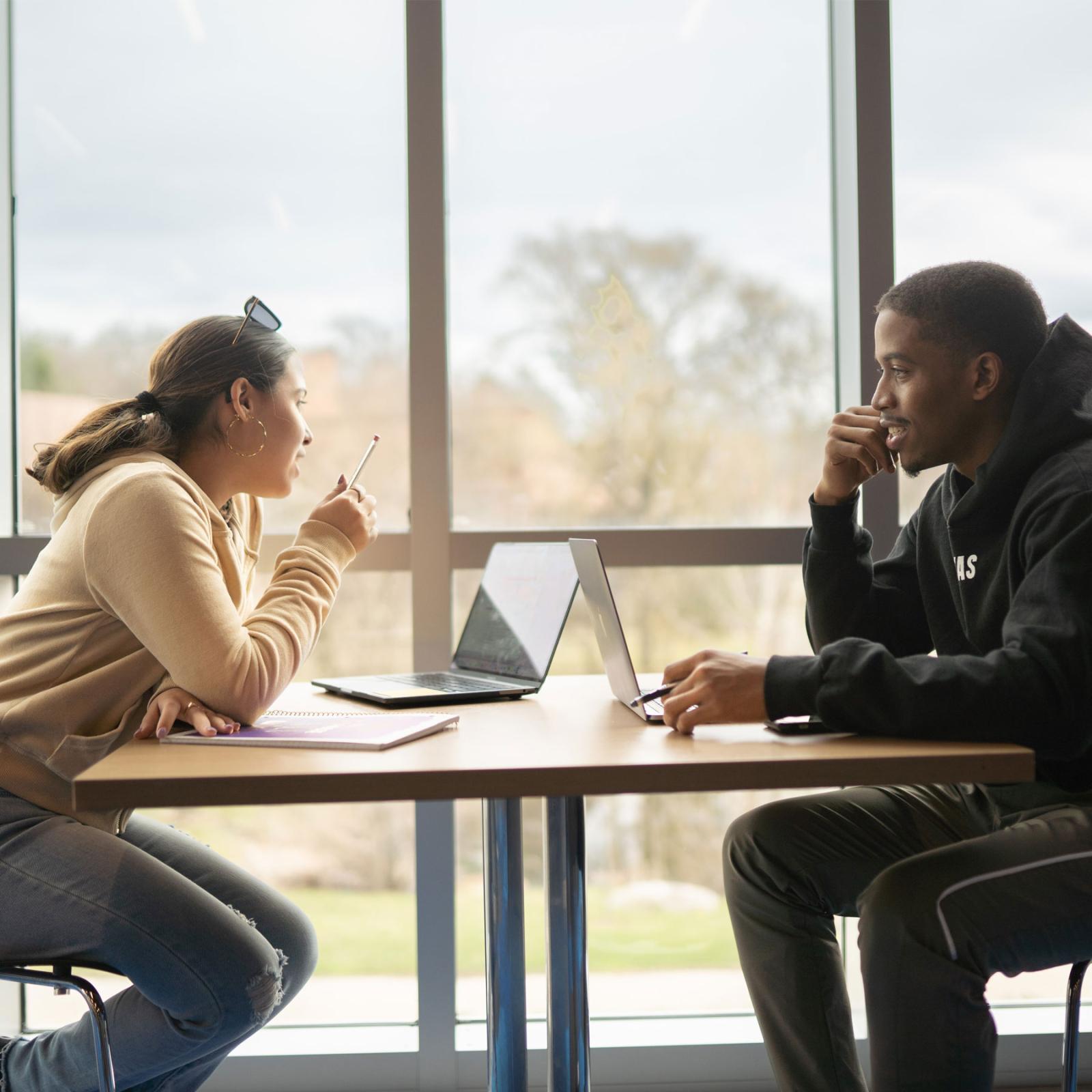 a man and woman sitting at a table