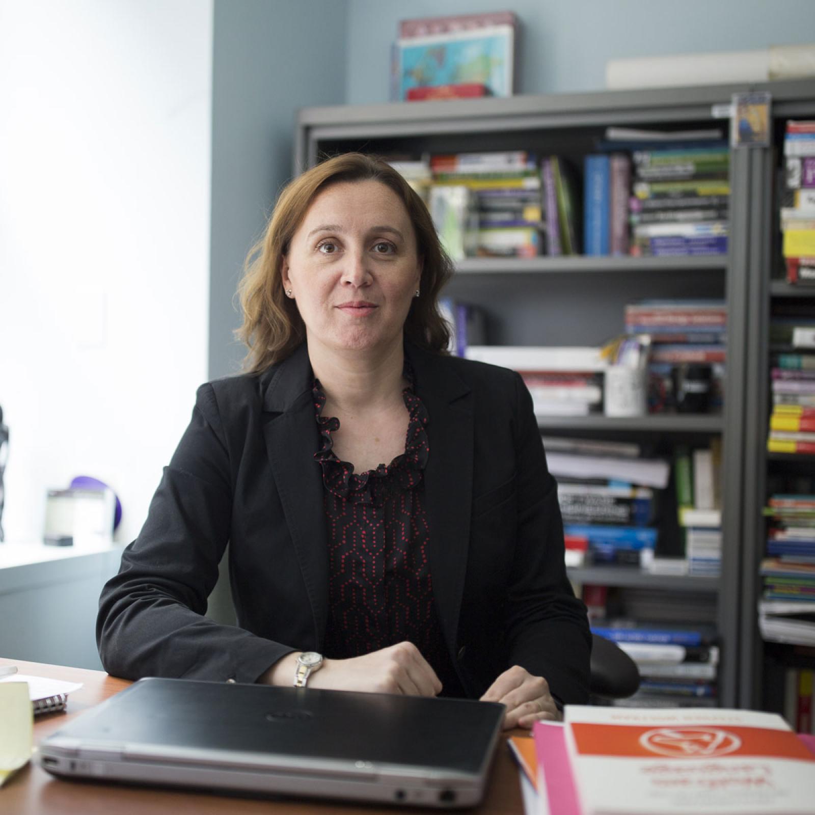 pace professor christelle scharff at her desk