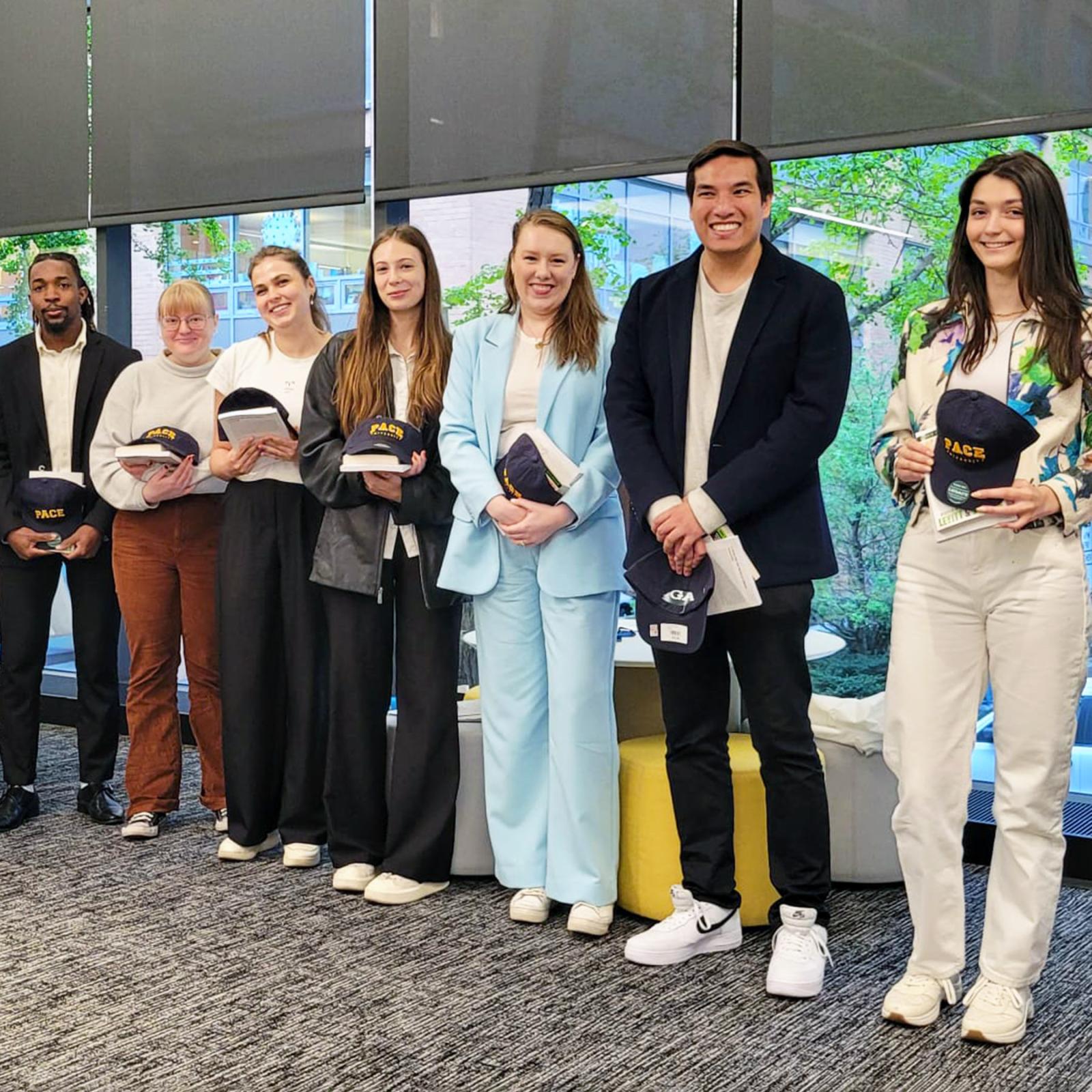 Group of Pace University economics students standing in a row