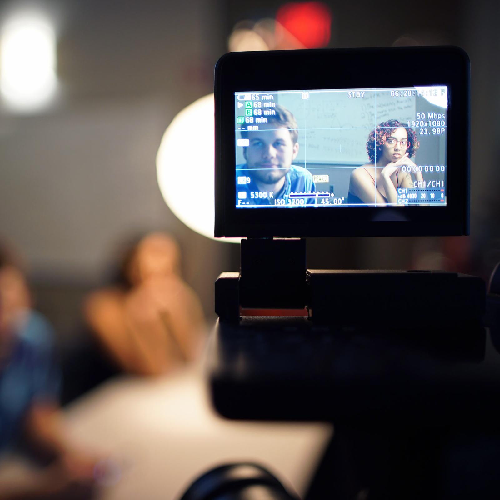 Pace University's Media, Communications, and Visual Arts students being filmed and the scene being viewed through the camera's preview