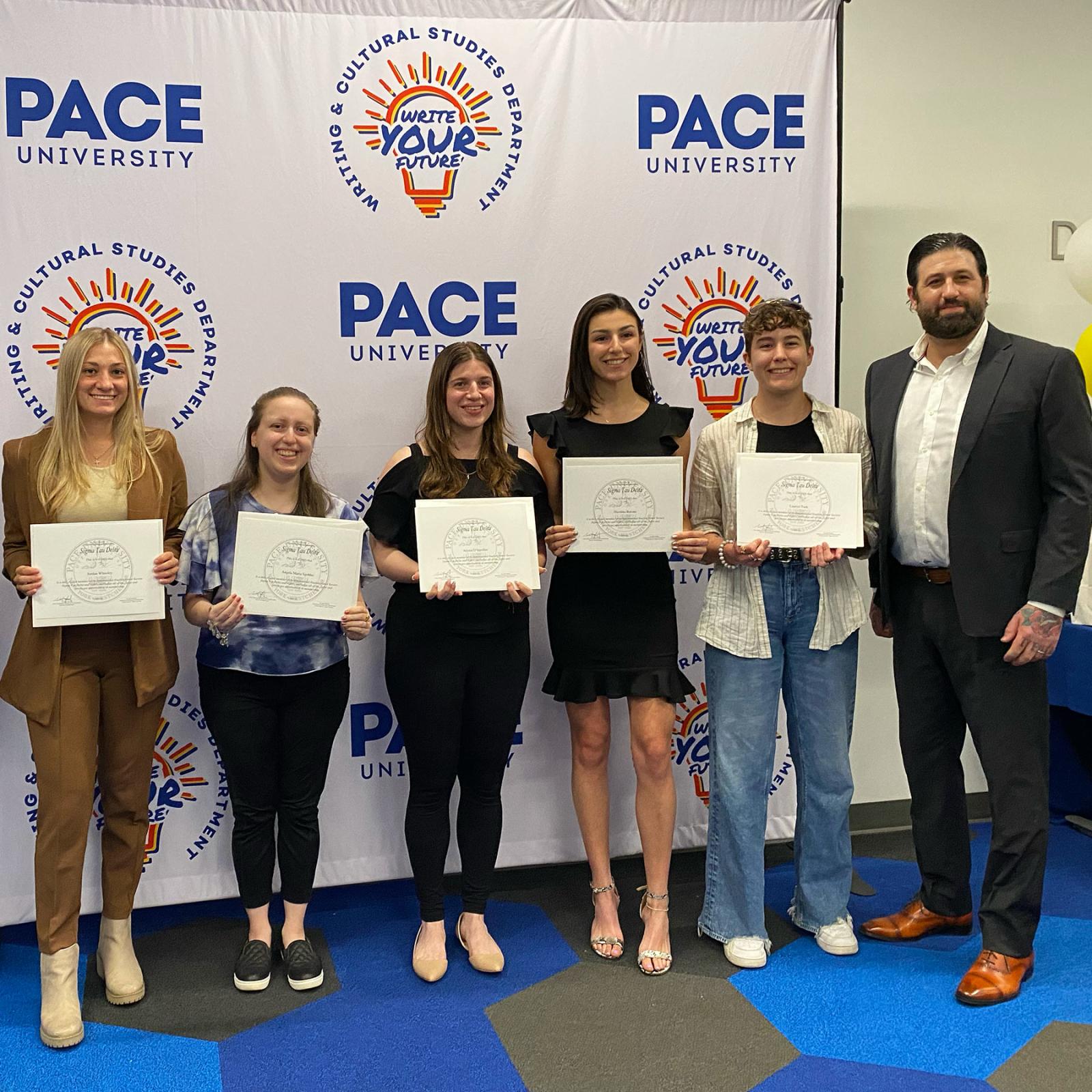 Group of Pace University Writing and Cultural Studies students receiving honor society certificates
