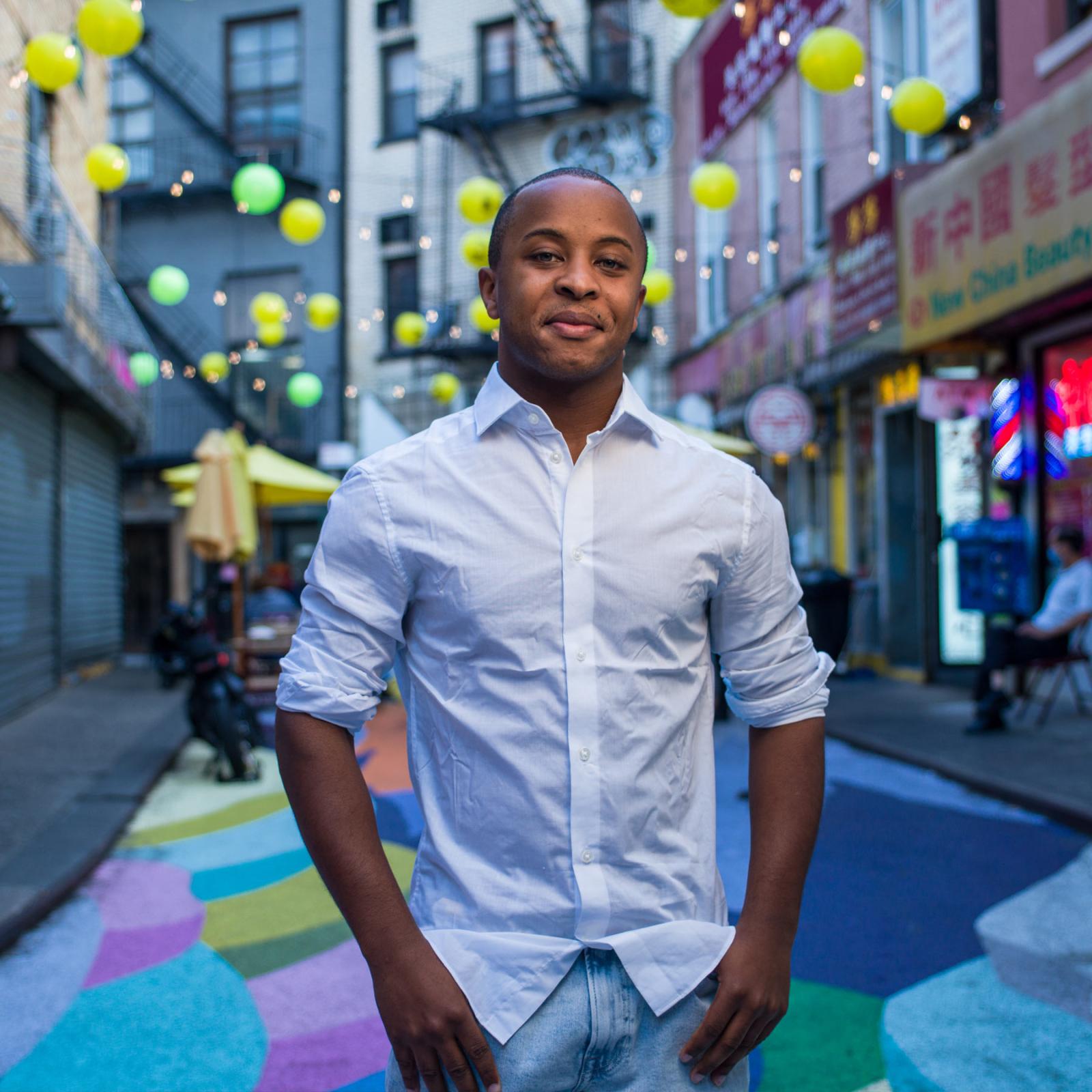 pace student standing in chinatown