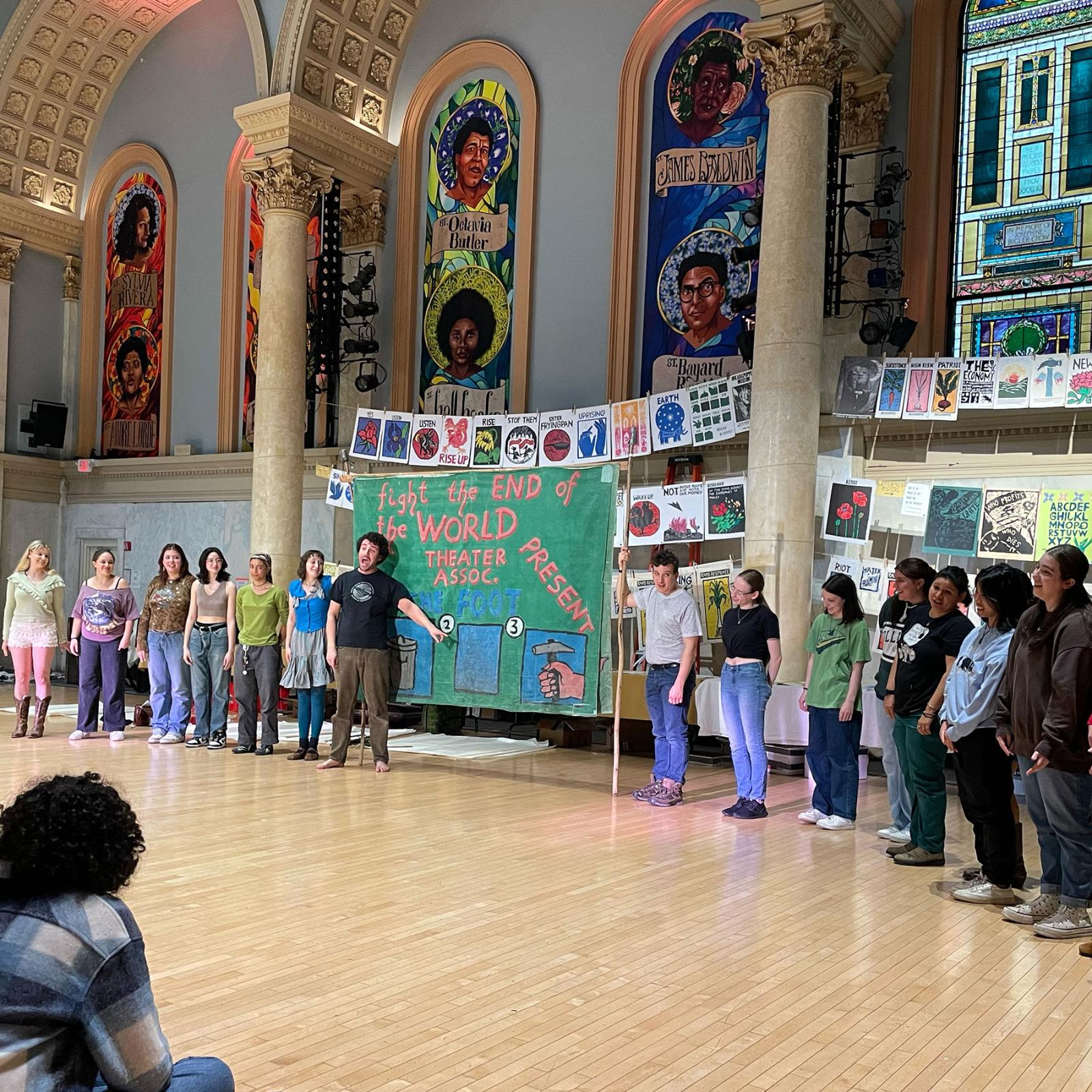 Pace University's Peace and Justice Studies and English students holding up artwork and working with the Bread and Puppet Theater to express social justice through art.