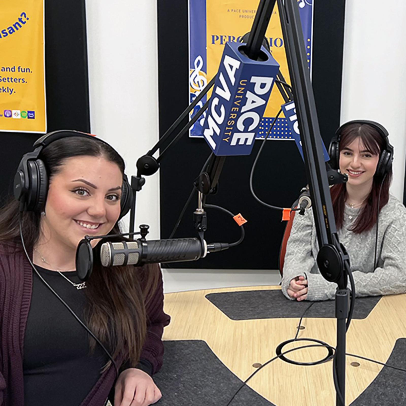 Two Pace University Criminal Justice and Security students with headphones and microphones to record a podcast
