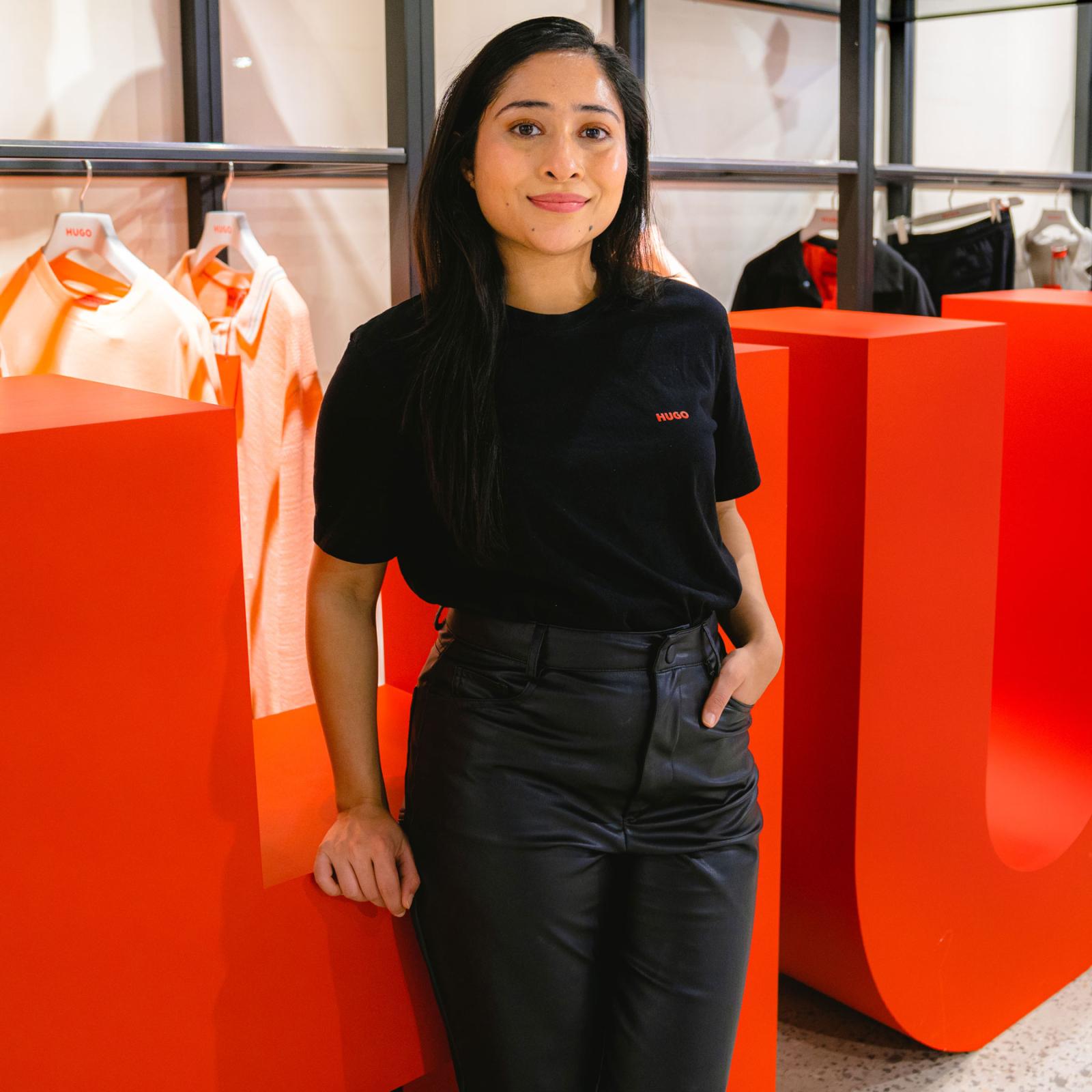A young woman standing in the HUGO Boss offices.