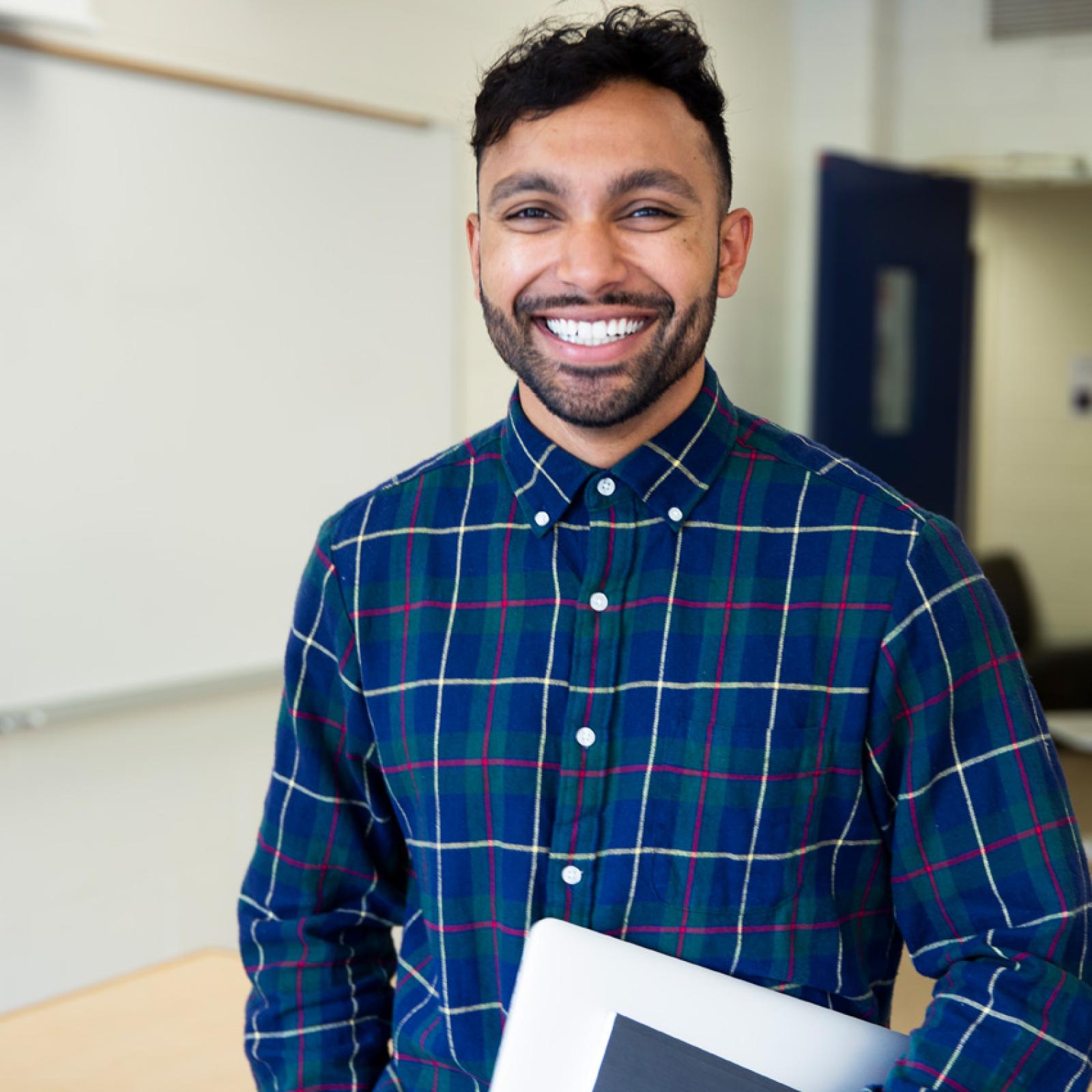 A Pace University teaching student smiling at the camera.
