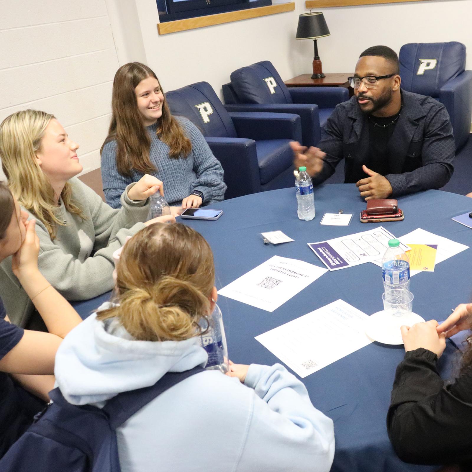Pace University student athletes being mentored by a Pace alum at a Setter Connect event.