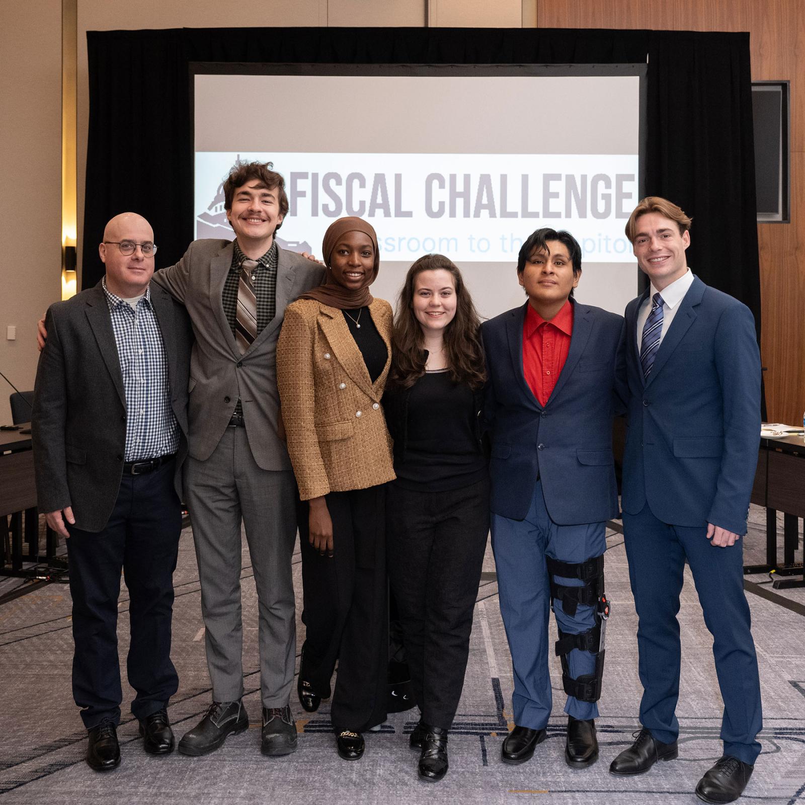 Pace University Economics Professor Sam Baruch with students from the Fiscal Challenge Team including William Winn, Fatima Abba, Kristina Krichmaryov, Angel Uzhca, and Victor Soulan