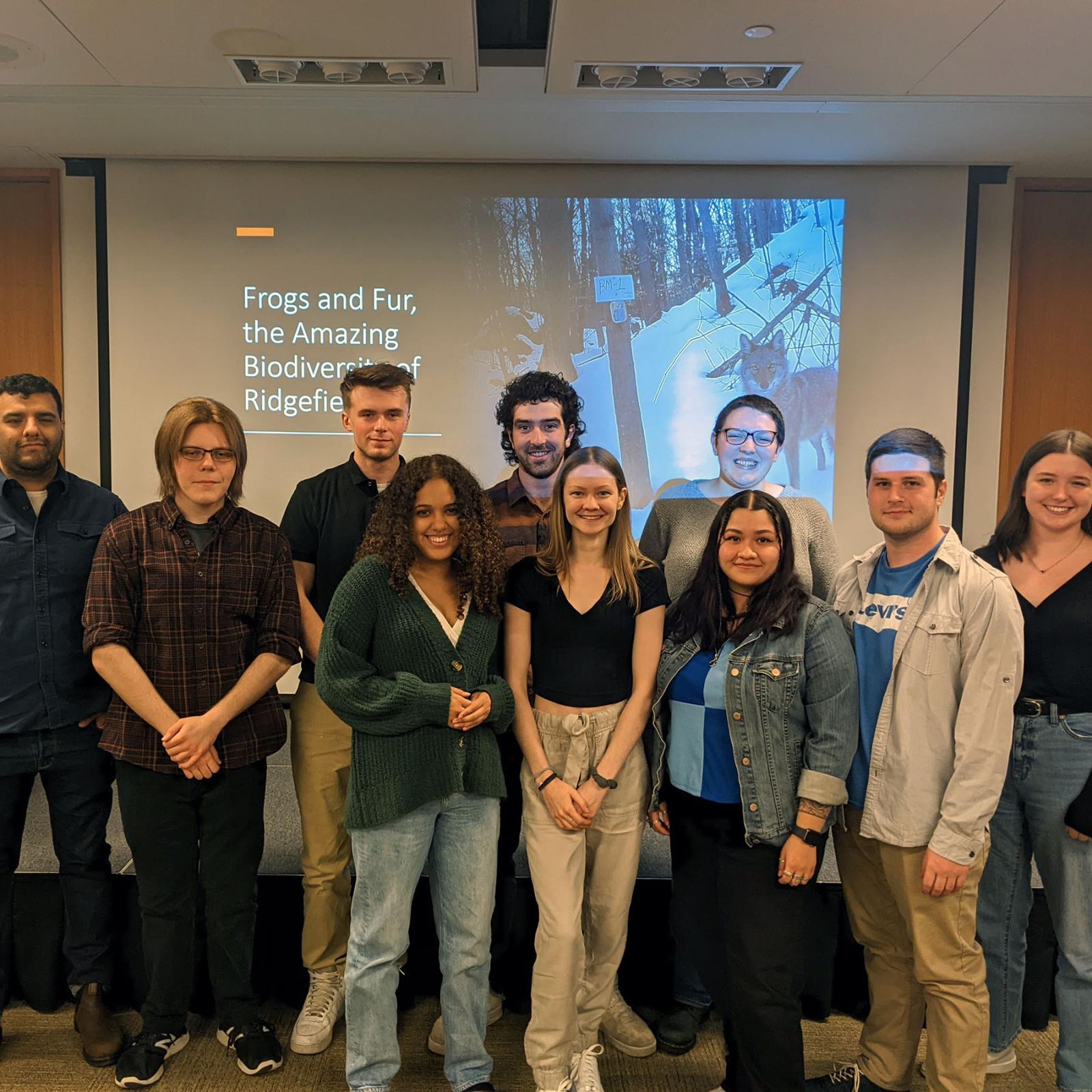 Group of Pace University Environmental Studies and Science students in front of a projected screen