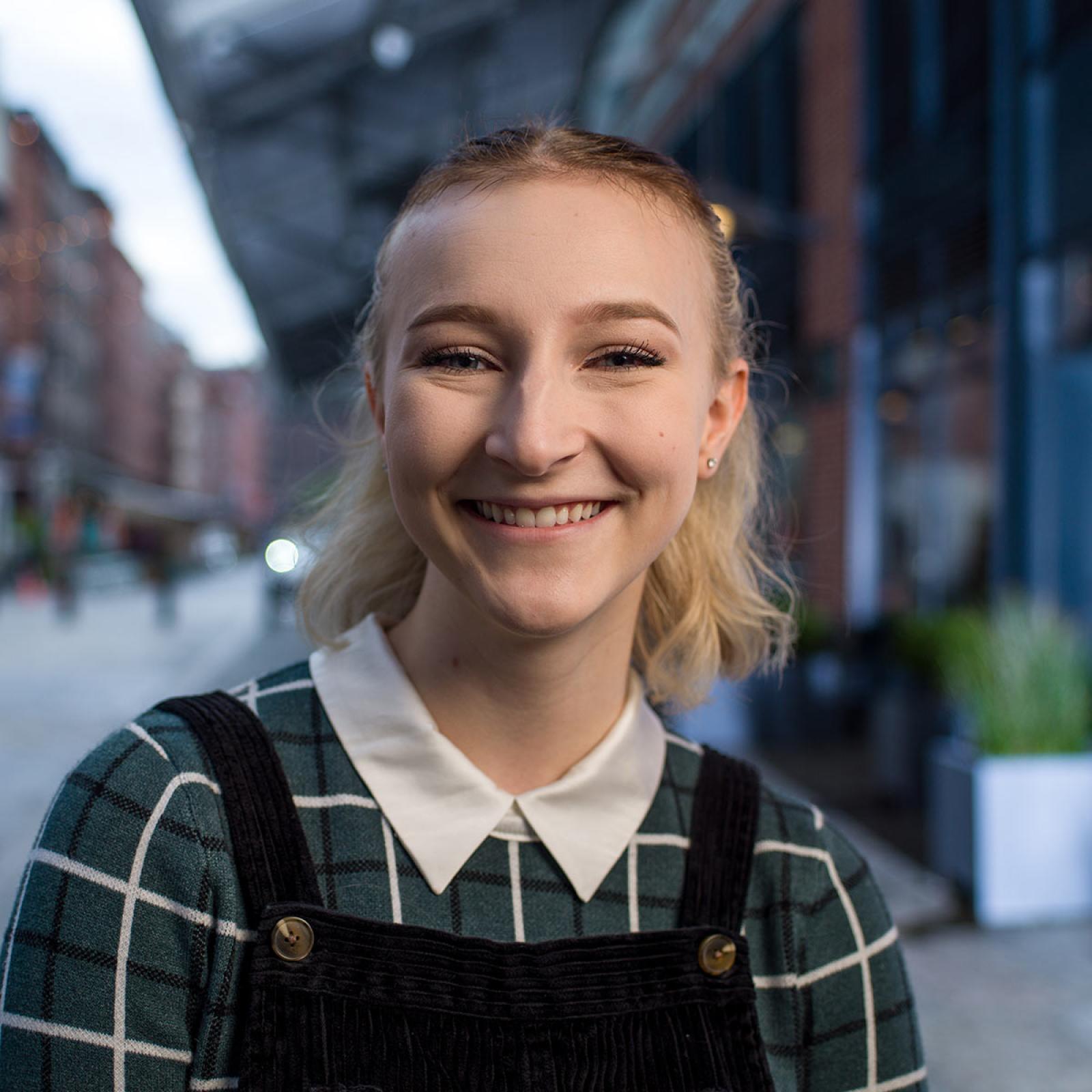 Pace University student smiling at the camera. 