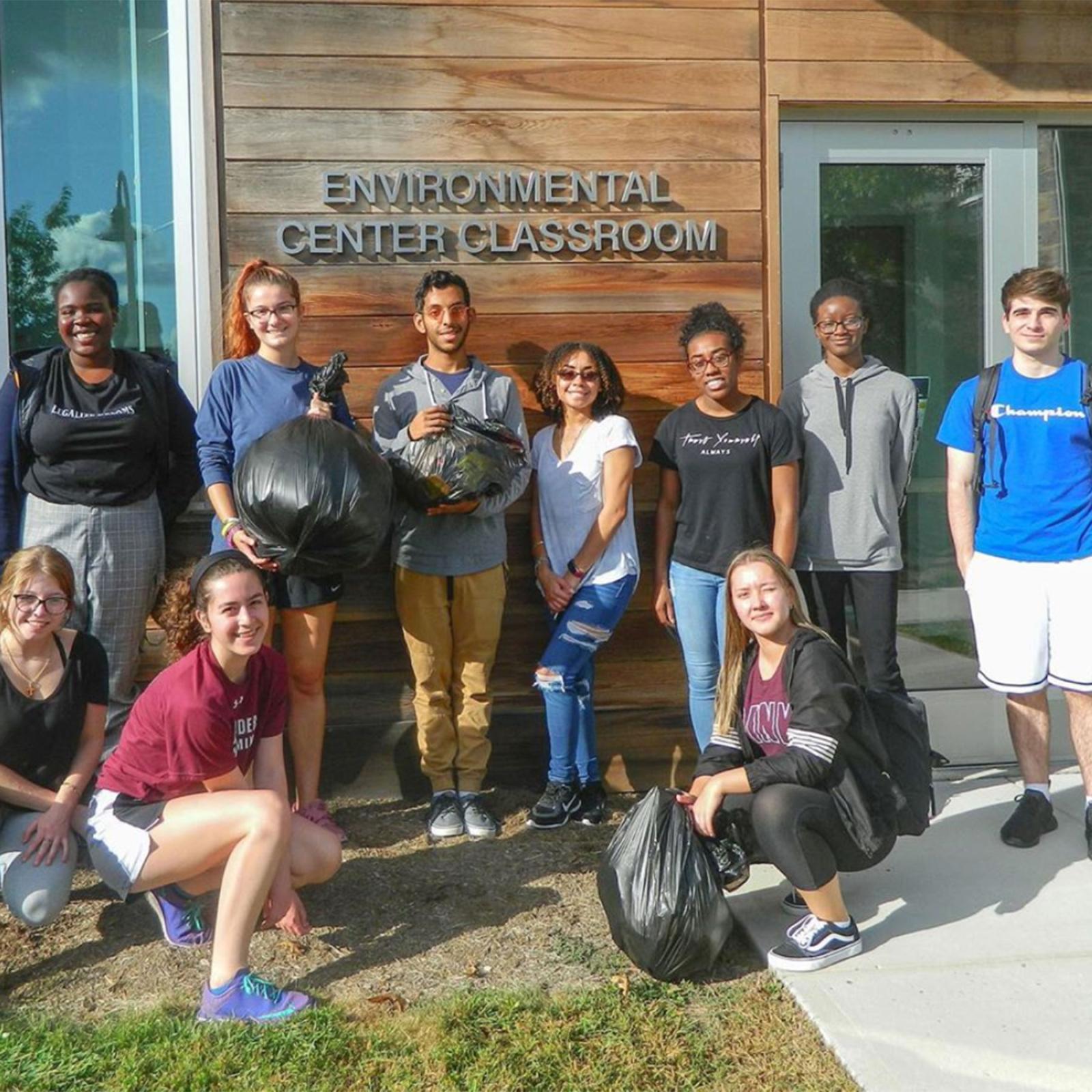 Group of Pace University Environmental Studies and Science students in front of the Environmental Center Classroom
