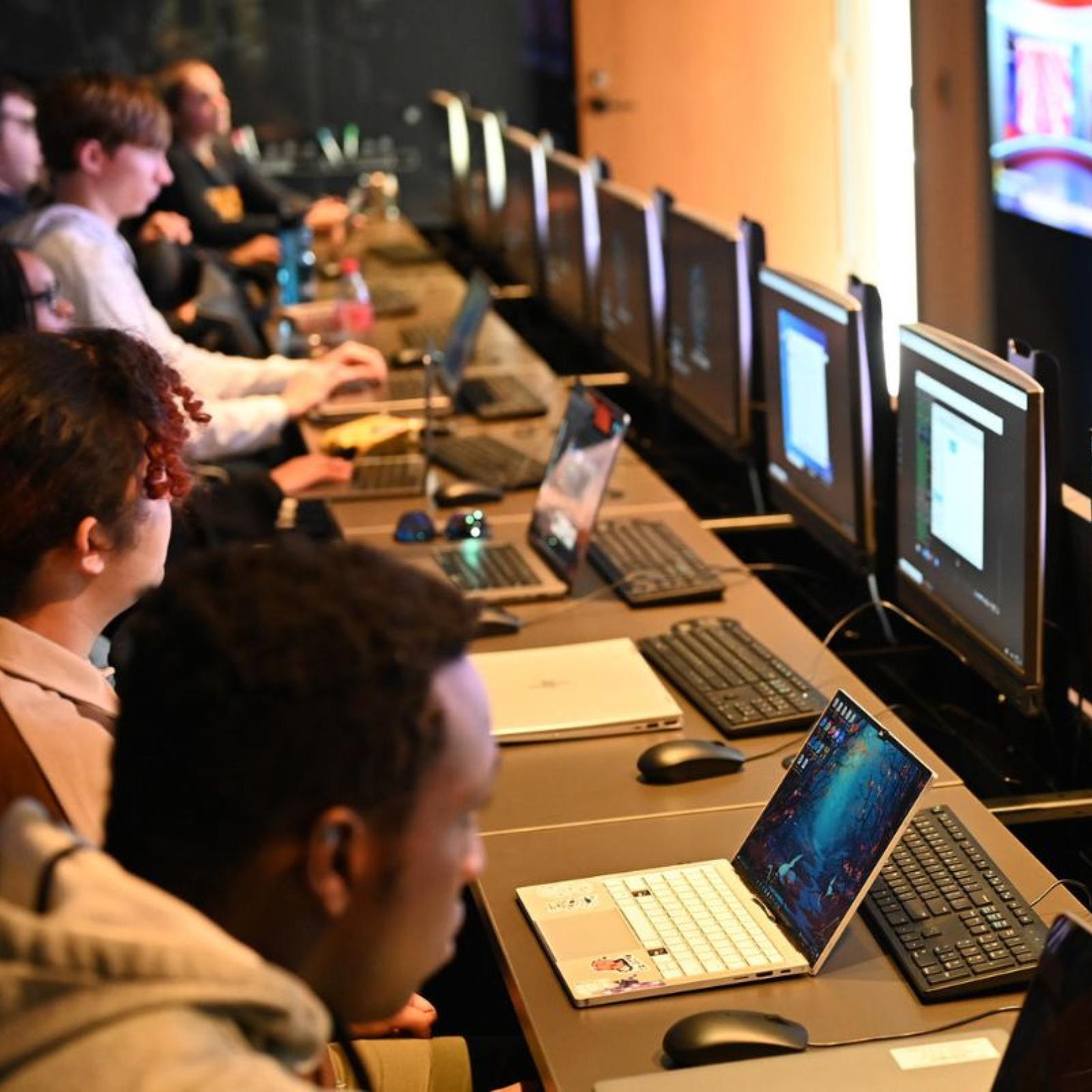 Group of Pace University students working on their computers.