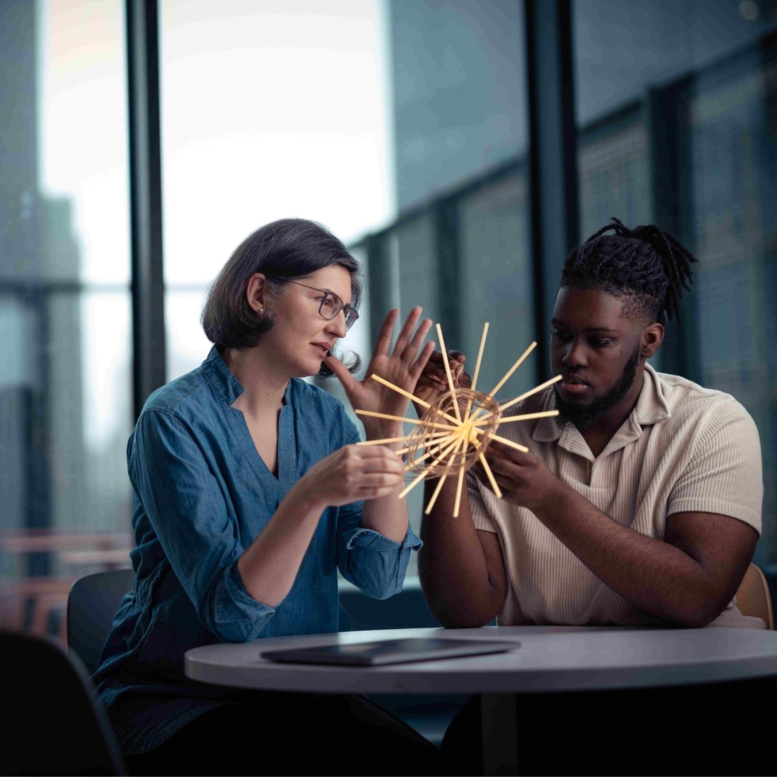 Seidenberg professor Andreea Cotoranu working on a prototype with a student.
