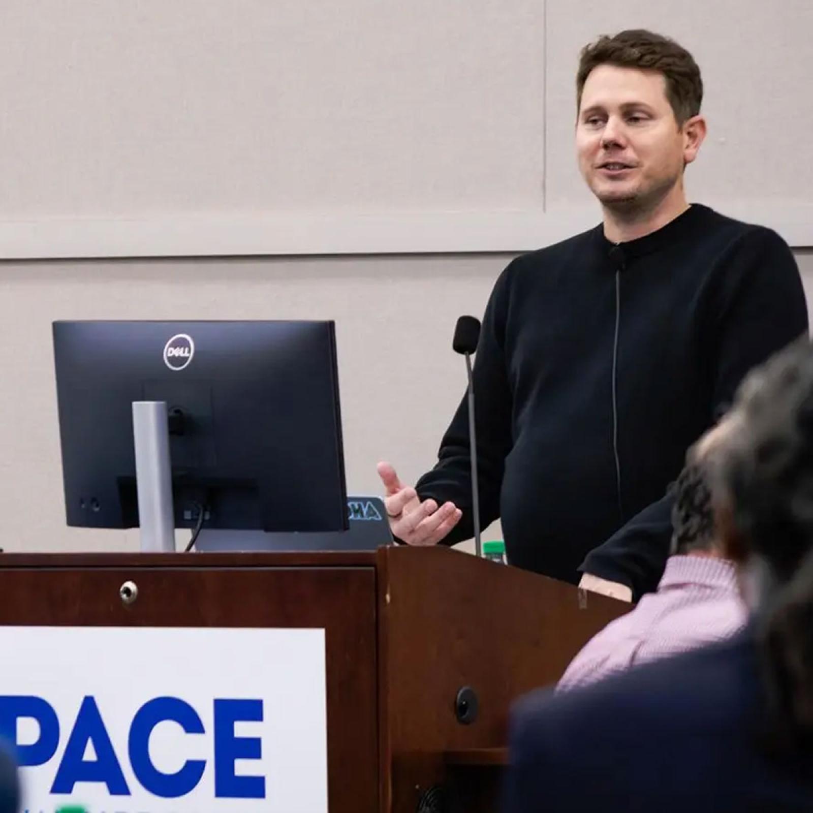 Google's Charles Elliot at a podium.