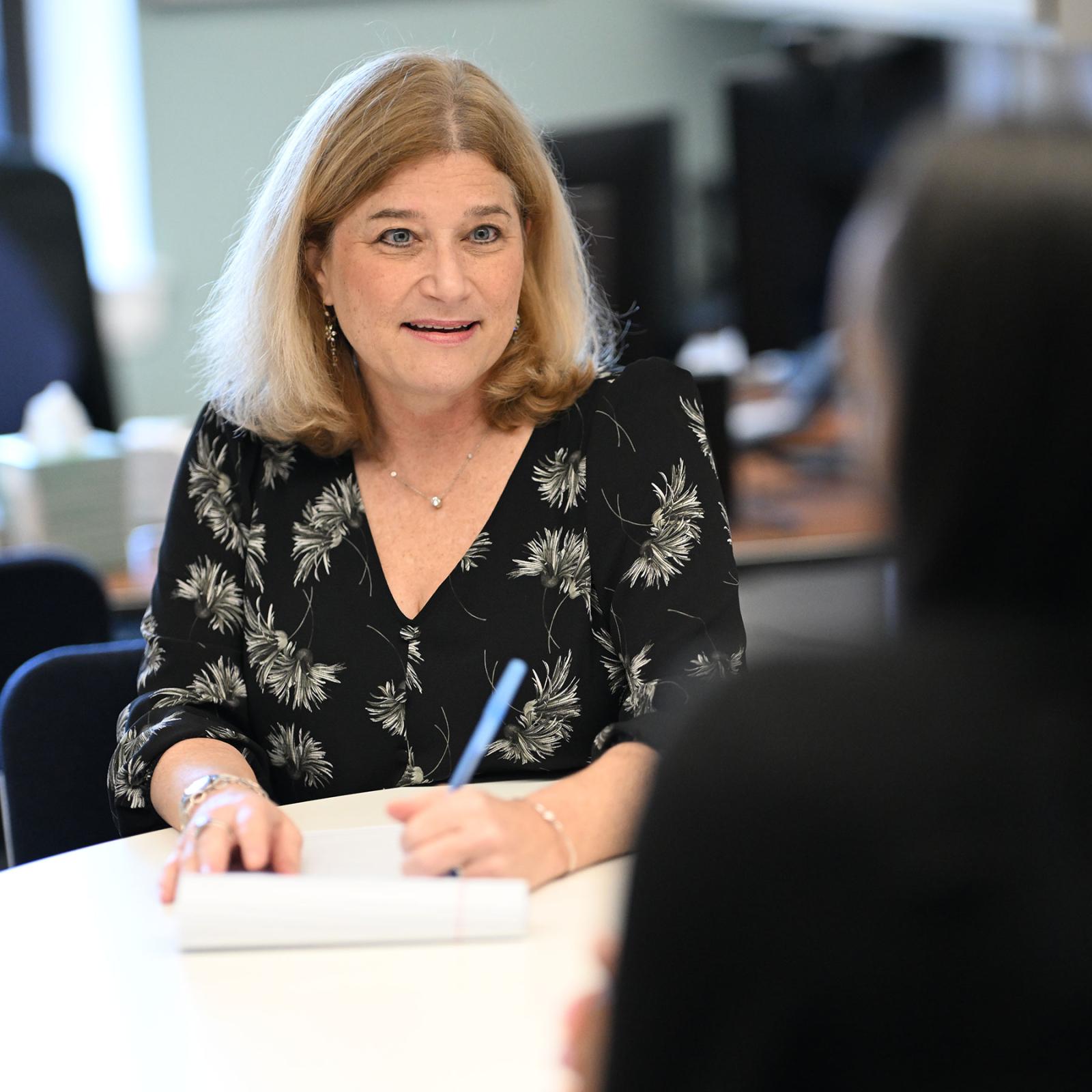Elisabeth Haub School of Law Professor Jill Gross meeting with a student