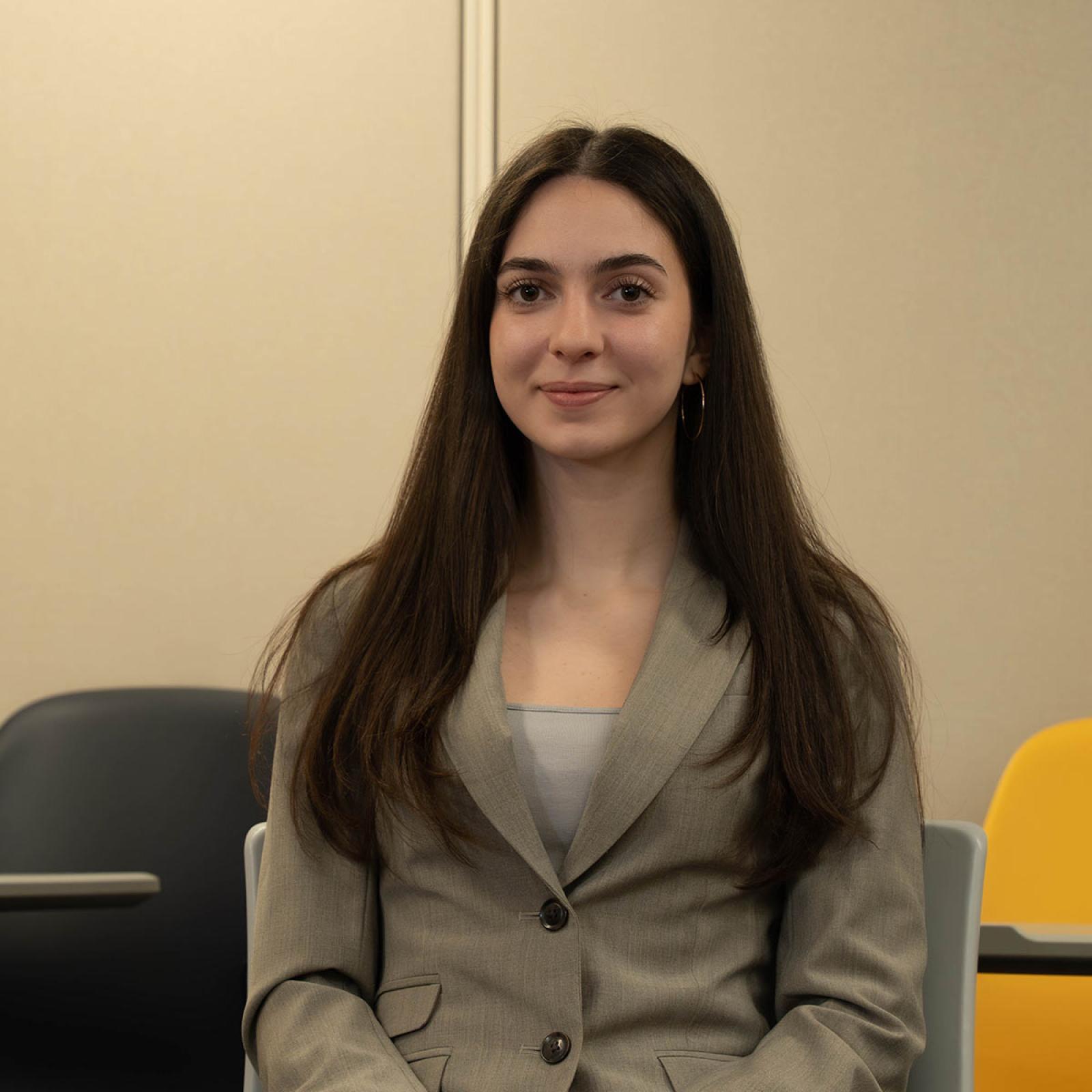 Pace University students wears a tan blazer